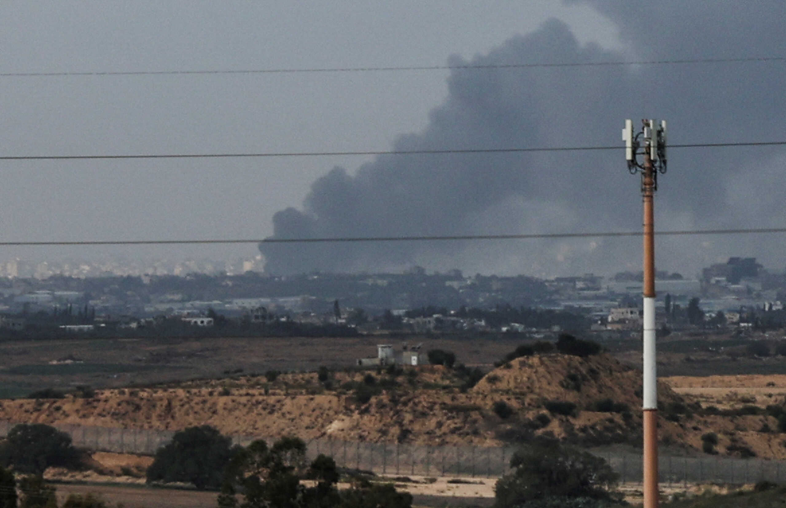Smoke rises over Gaza, amid the ongoing conflict between Israel and the Palestinian Islamist group Hamas, as seen from southern Israel, December 25, 2023. REUTERS