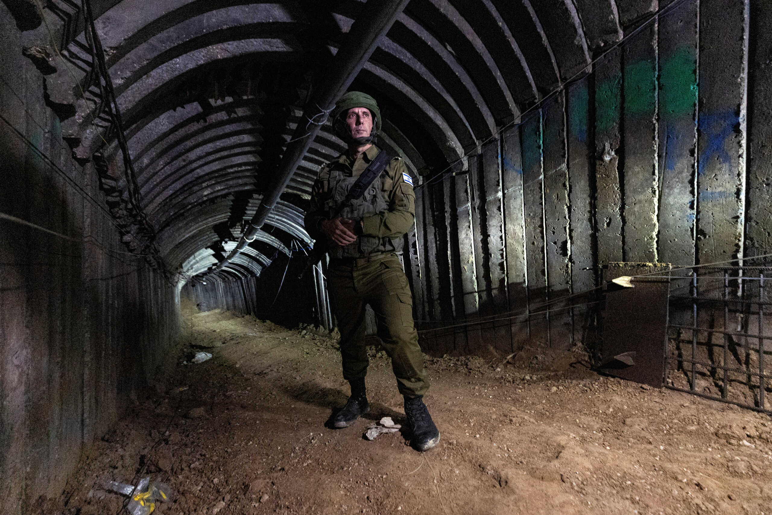 Israeli military spokesperson Rear Admiral Daniel Hagari stands in what Israel's military says is an iron-girded tunnel designed by Hamas to disgorge carloads of Palestinian fighters for a surprise storming of the border, amid the Israeli army's ongoing ground operation against Palestinian Islamist group Hamas, close to Erez crossing in the northern Gaza Strip, December 15, 2023. REUTERS