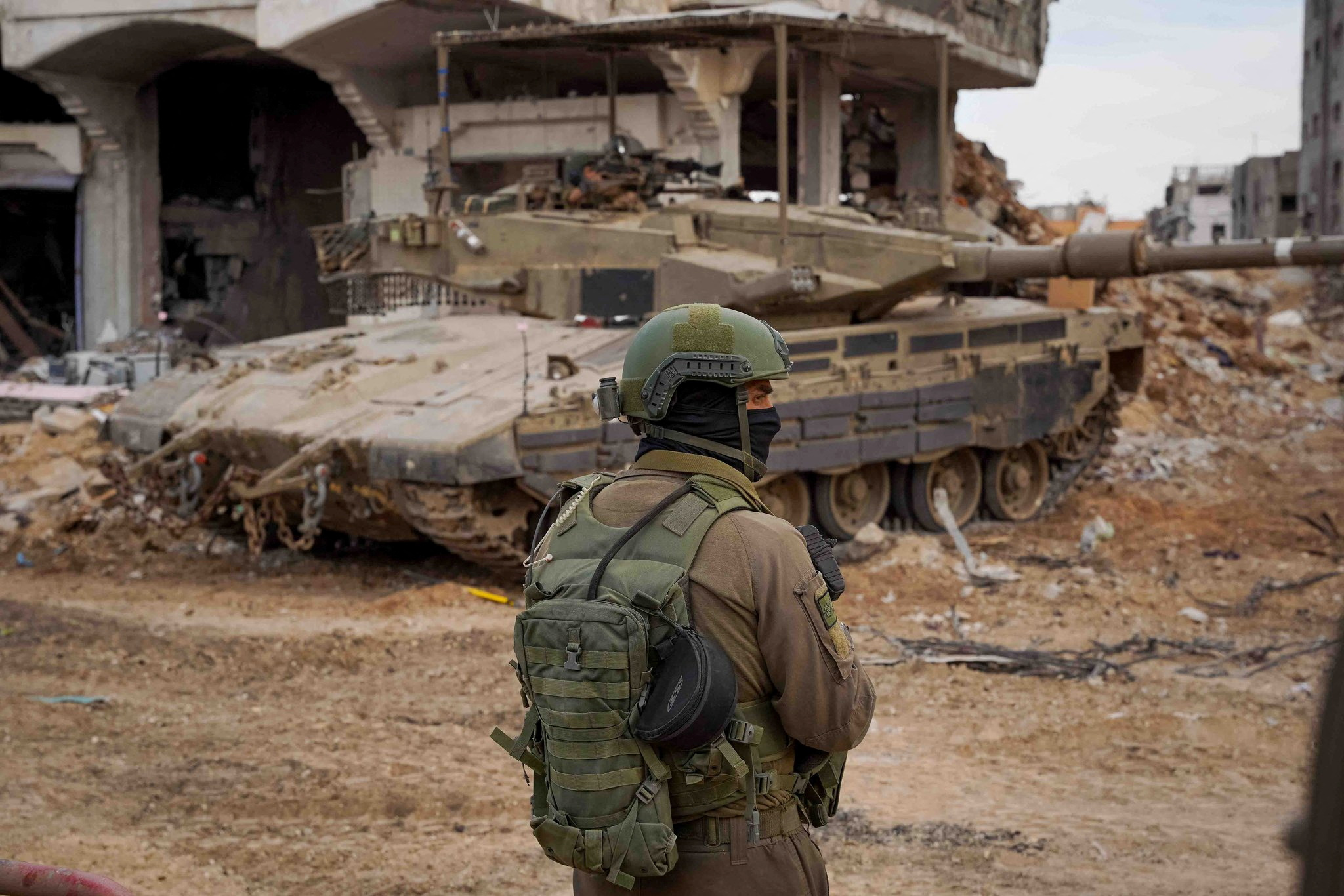 An Israeli soldier looks on as they operate in the Gaza Strip, after a temporary truce between Israel and the Palestinian Islamist group Hamas expired, in this handout picture released on December 1, 2023. Israel Defense Forces