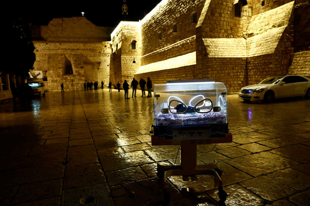 An installation by Rana Bishara shows a figure of baby Jesus, made by Sana Fara Bishara, inside an incubator in front the Church of the Nativity in support of Gaza, in Bethlehem, in the Israeli-occupied West Bank, December 24, 2023. REUTERS