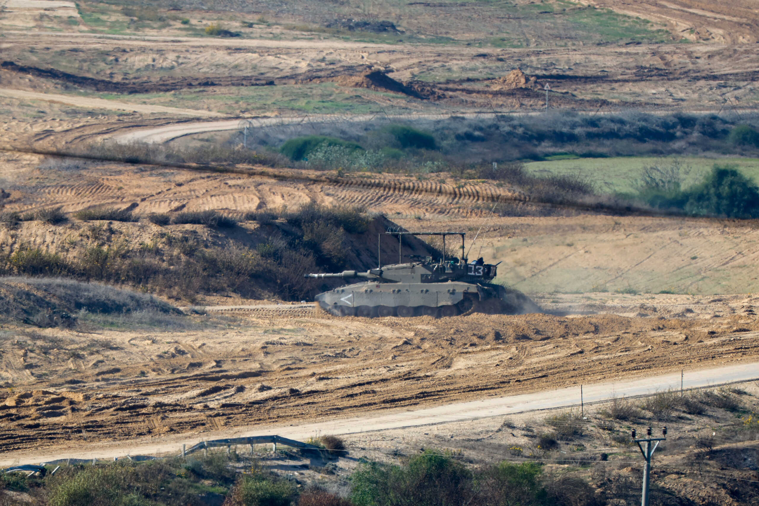 An Israeli tank operates near Gaza, after a temporary truce between Israel and the Palestinian Islamist group Hamas expired, as seen from southern Israel, December 2, 2023. REUTERS