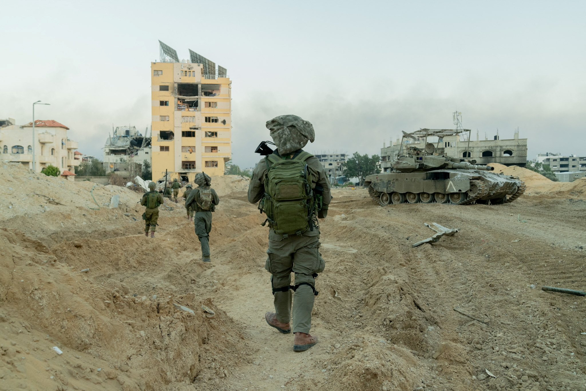 Israeli soldiers operate in the Gaza Strip amid the ongoing conflict between Israel and the Palestinian Islamist group Hamas, in this handout picture released on December 21, 2023. Israel Defense Forces