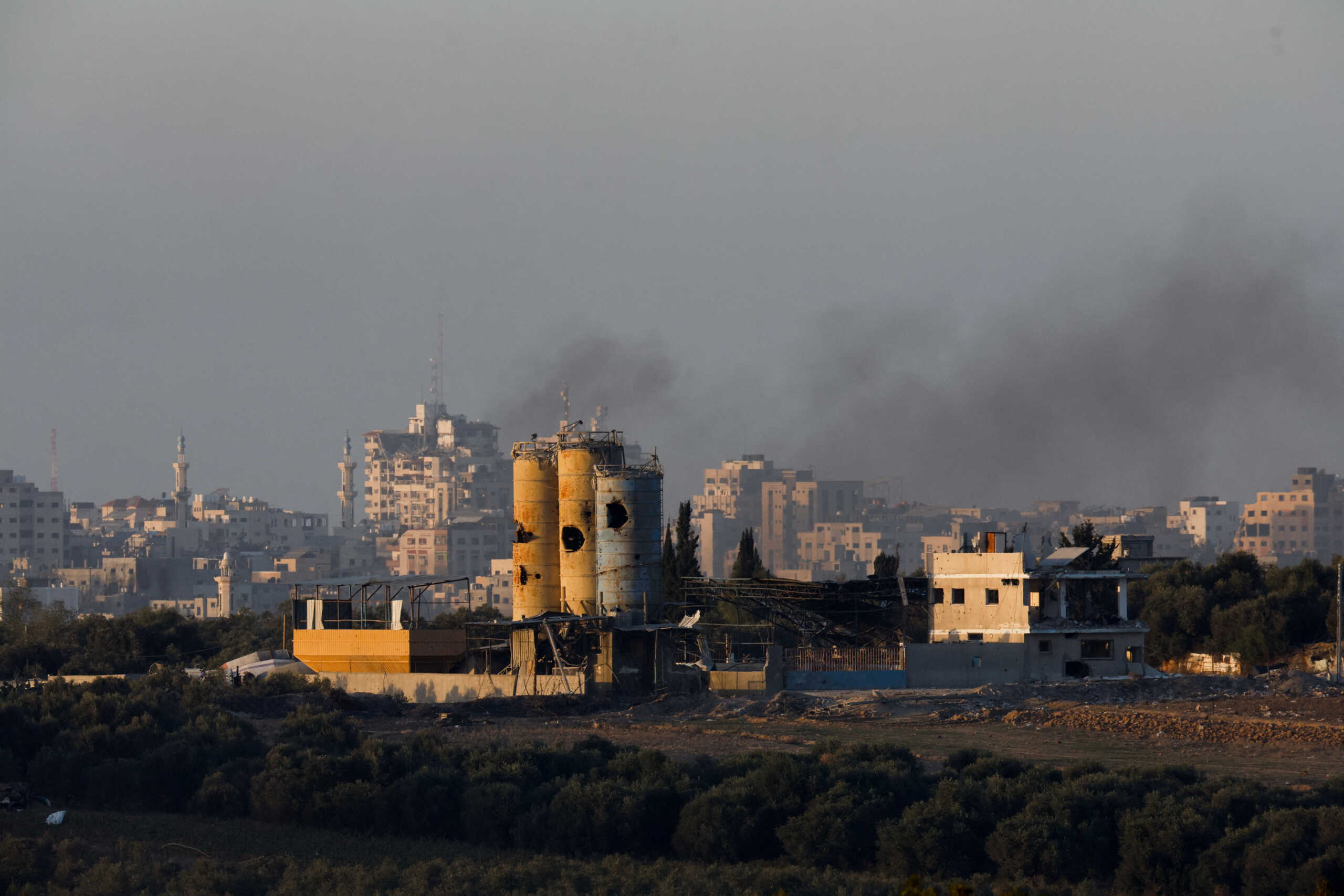 Smoke rises inside central Gaza strip following an airstrike, amid the ongoing conflict between Israel and the Palestinian Islamist group Hamas, as seen from southern Israel, December 11, 2023. REUTERS
