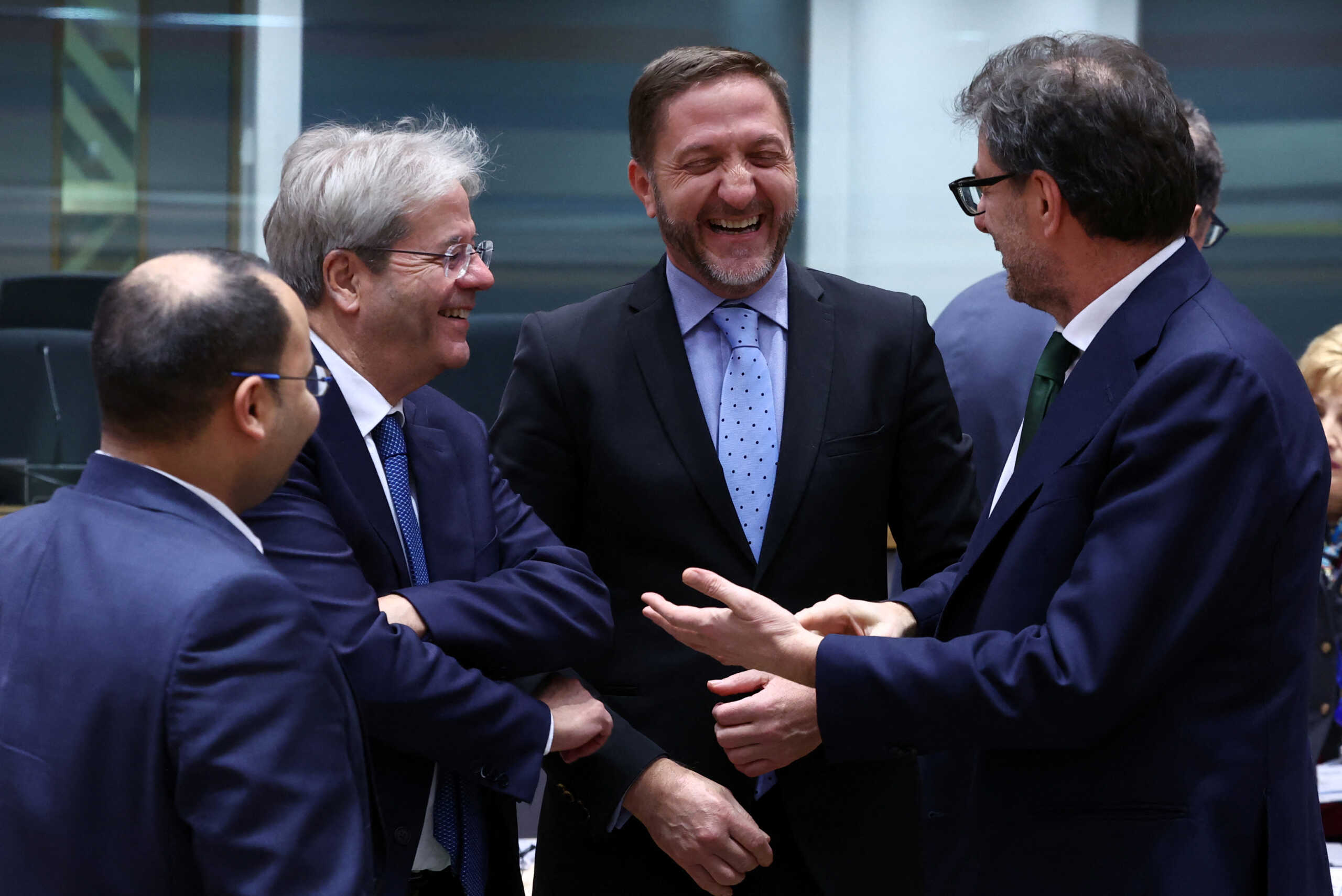Malta's Finance Minister Clyde Caruana, European Commissioner for Economy Paolo Gentiloni, Slovenia's Finance Minister Klemen Bostjancic and Italy's Finance Minister Giancarlo Giorgetti talk on the day of the Eurozone finance ministers meeting in Brussels, Belgium December 7, 2023. REUTERS