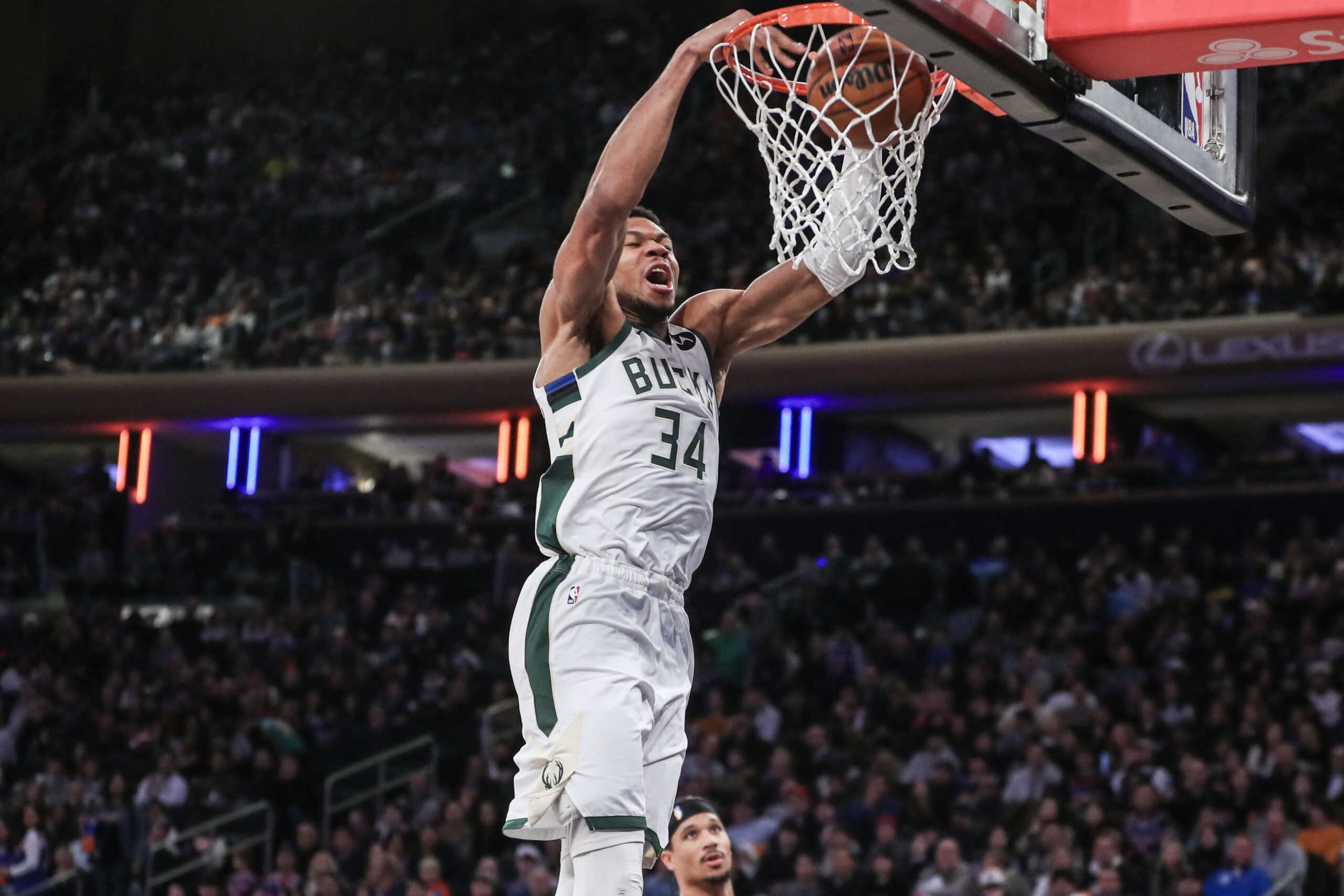 Dec 23, 2023; New York, New York, USA;  Milwaukee Bucks forward Giannis Antetokounmpo (34) dunks in the fourth quarter against the New York Knicks at Madison Square Garden. Mandatory Credit: Wendell Cruz-USA TODAY Sports