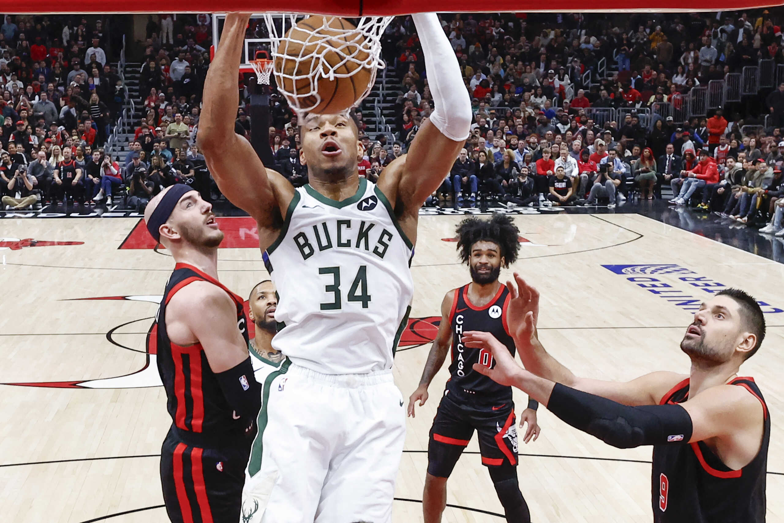 Nov 30, 2023; Chicago, Illinois, USA; Milwaukee Bucks forward Giannis Antetokounmpo (34) dunks the ball against the Chicago Bulls during the second half at United Center. Mandatory Credit: Kamil Krzaczynski-USA TODAY Sports