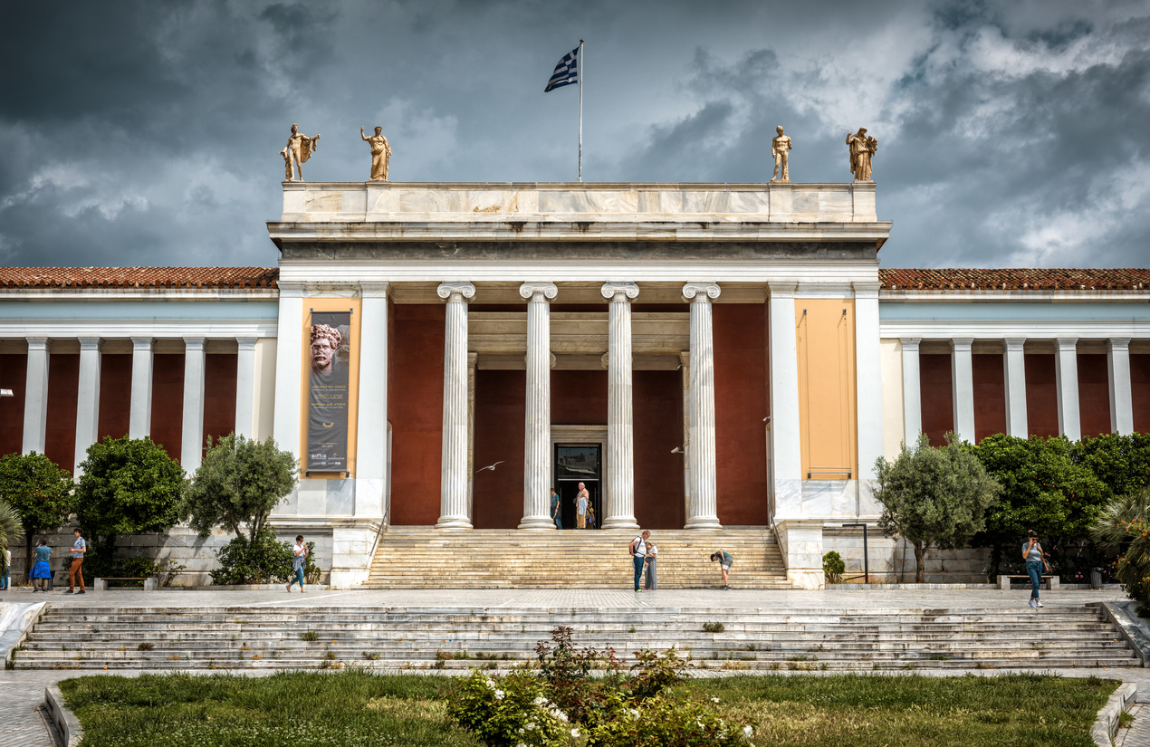 Athens - May 7, 2018: National Archaeological Museum of Athens, Greece. It is one of the main historical landmarks of Athens. Main entrance of museum under the dramatic sky.