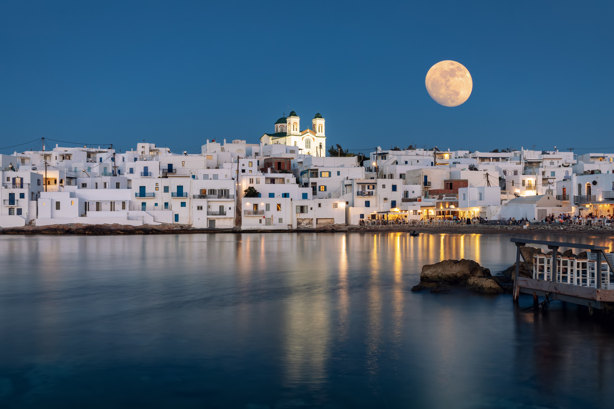 August summer full moon over the idyllic village of Naousa on on the island of Paros, Cyclades, Greece