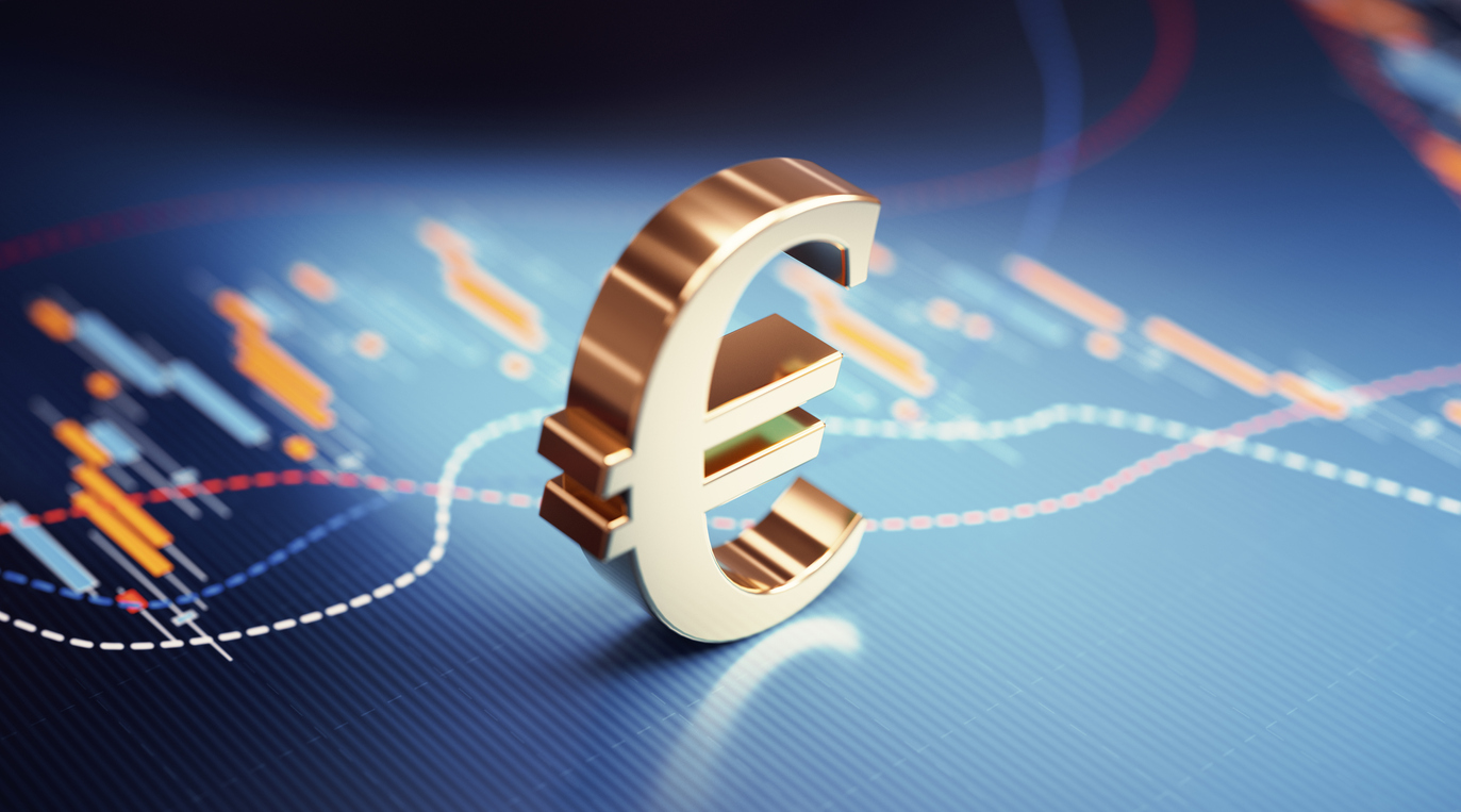Euro symbol sitting over blue financial bar graph. Selective focus. Horizontal composition with copy space. Stock market and finance concept.