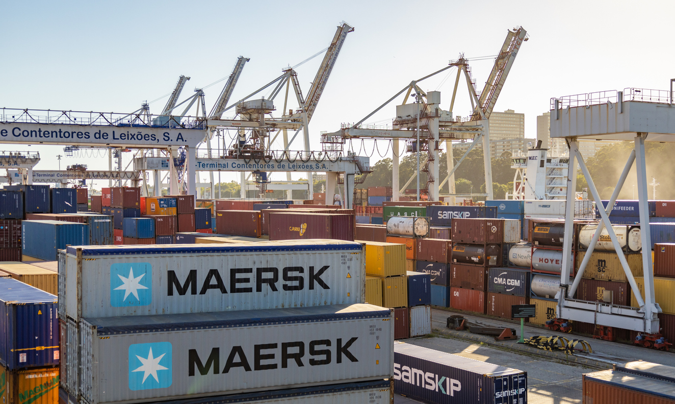 Matosinhos, Portugal - June 30, 2022: A picture of colorful cargo containers at the Leixões Container Terminal at sunset.