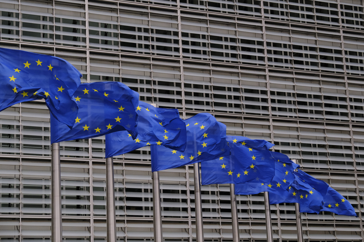 European flags flap in the wind outside EU headquarters in Brussels, Belgium on July 21st, 2022