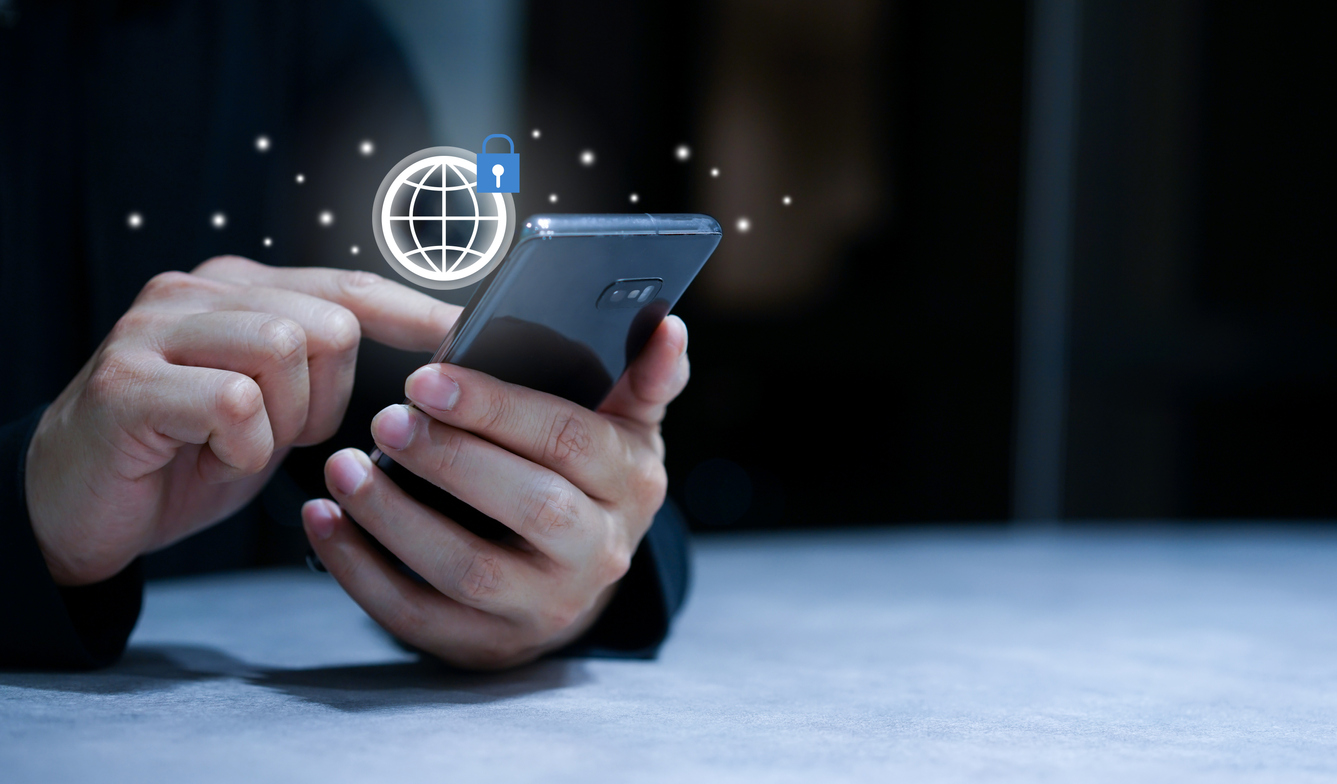 close up man hand hold smartphone to check or access on private account on website with network security system for PDPA data protection and technology concept