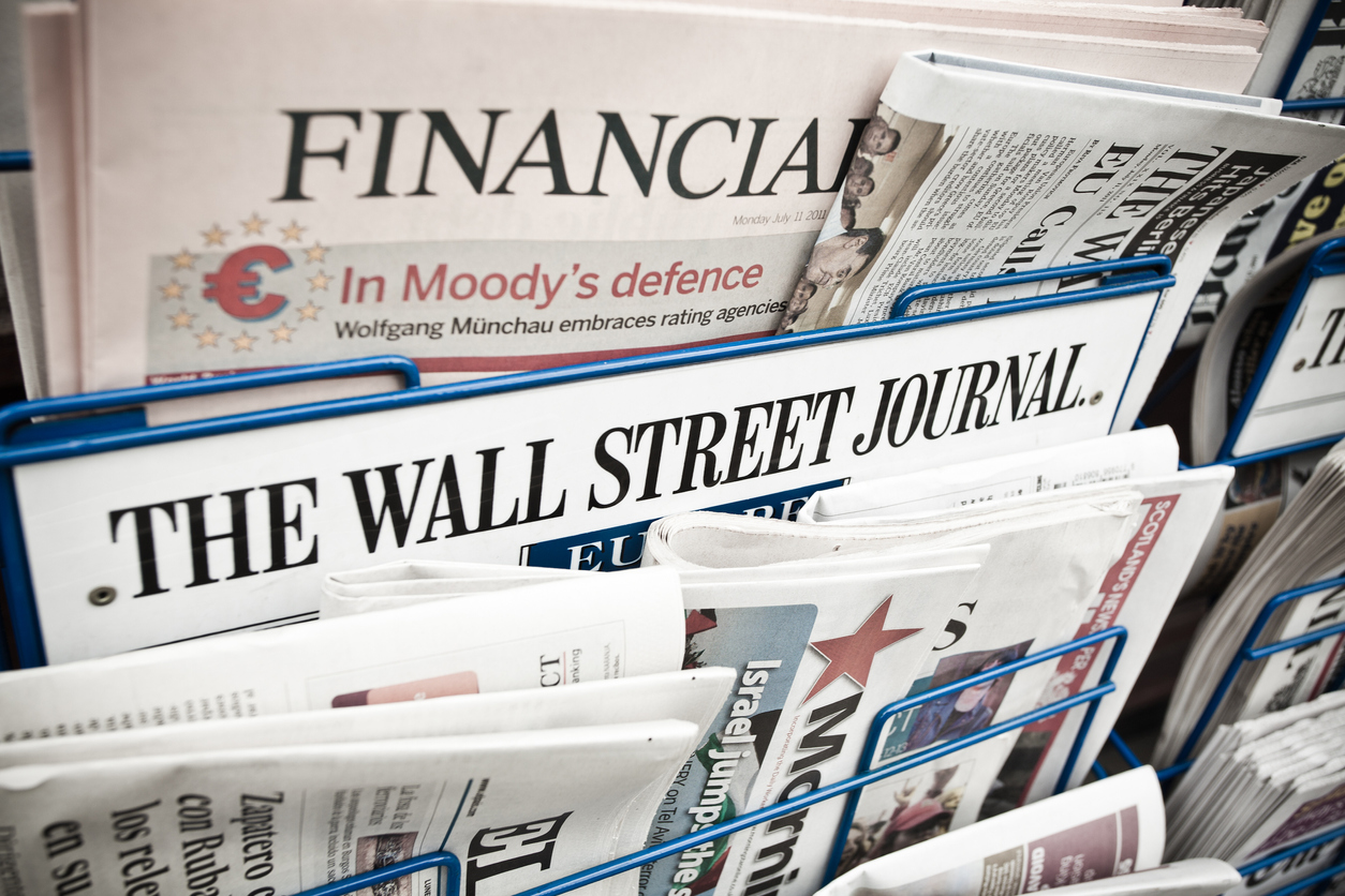London, United Kingdom- July 11, 2011: Financial Newspapers on a Newsstand including the financial times, the Wall Street Journal and El Pais. The Financial Times (FT) is a morning daily newspaper published in London and printed in 24 cities around the world.