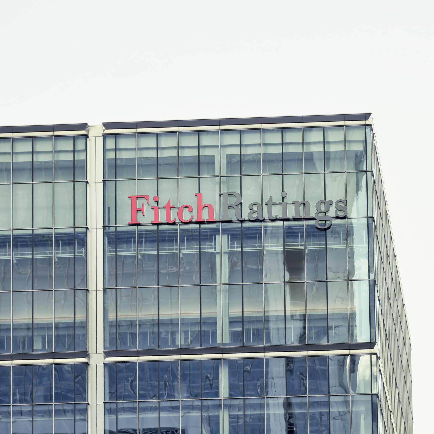 London, UK - October 29, 2013: Corporate branding on the headquarter buildings of Fitch Ratings at day in London.