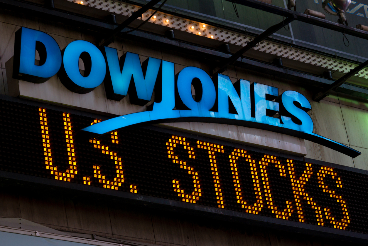 New York, USA - July 29, 2016: The illuminated Dow Jones sign in times square late in the night as the latest news streams on the led board.