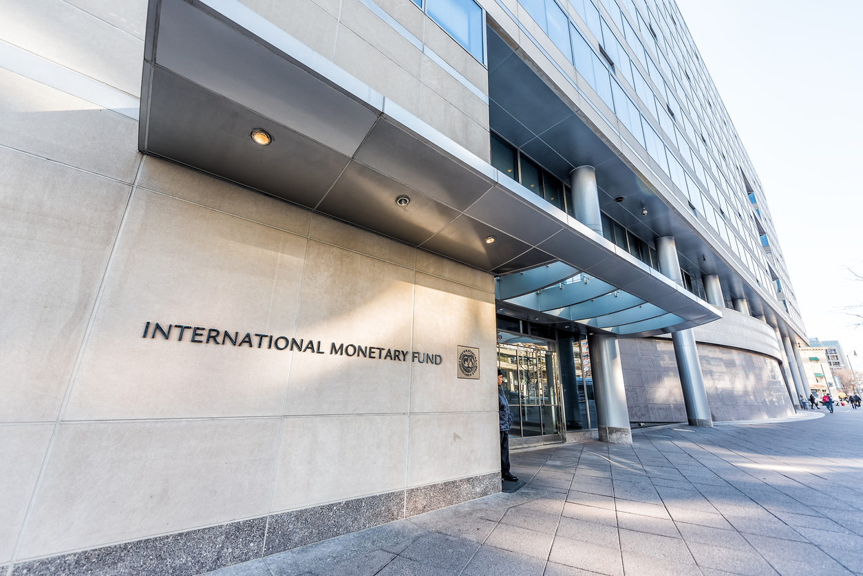 Washington DC, USA - March 9, 2018: IMF entrance with sign of International Monetary Fund, concrete architecture building wall security guard doors