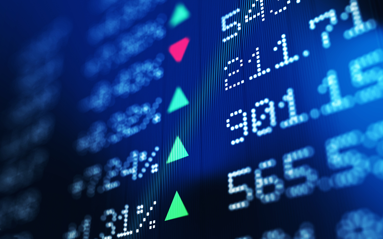 Financial data analysis graph showing stock market trends on a trading board. Horizontal composition with copy space and selective focus.