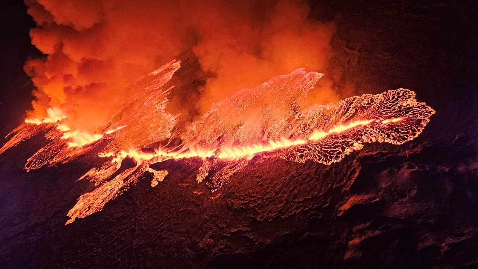 A volcano spews lava and smoke as it erupts in Grindavik, Iceland, December 18, 2023.  Civil Protection of Iceland