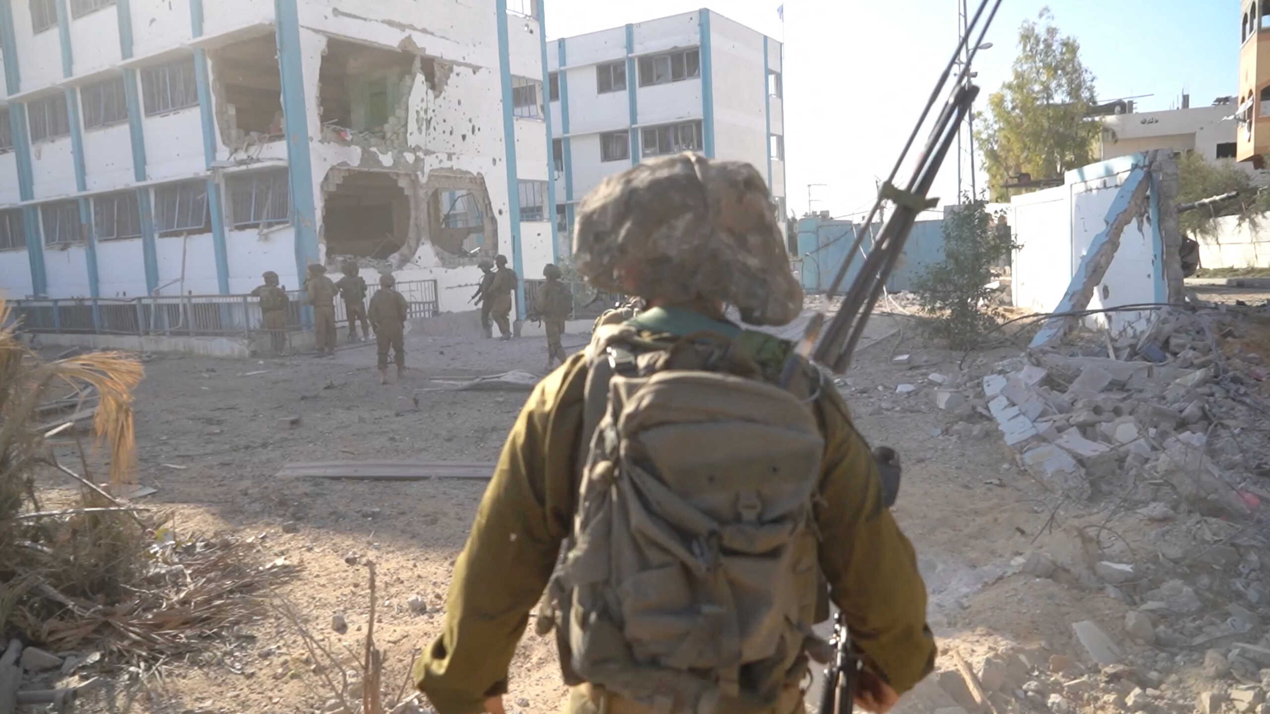 An Israeli soldier takes position during the ongoing ground operation of the Israeli army against Palestinian Islamist group Hamas, in a location given as Jabalya, in Gaza, in this handout still image obtained from a video  released on December 2, 2023. Israel Defense Forces