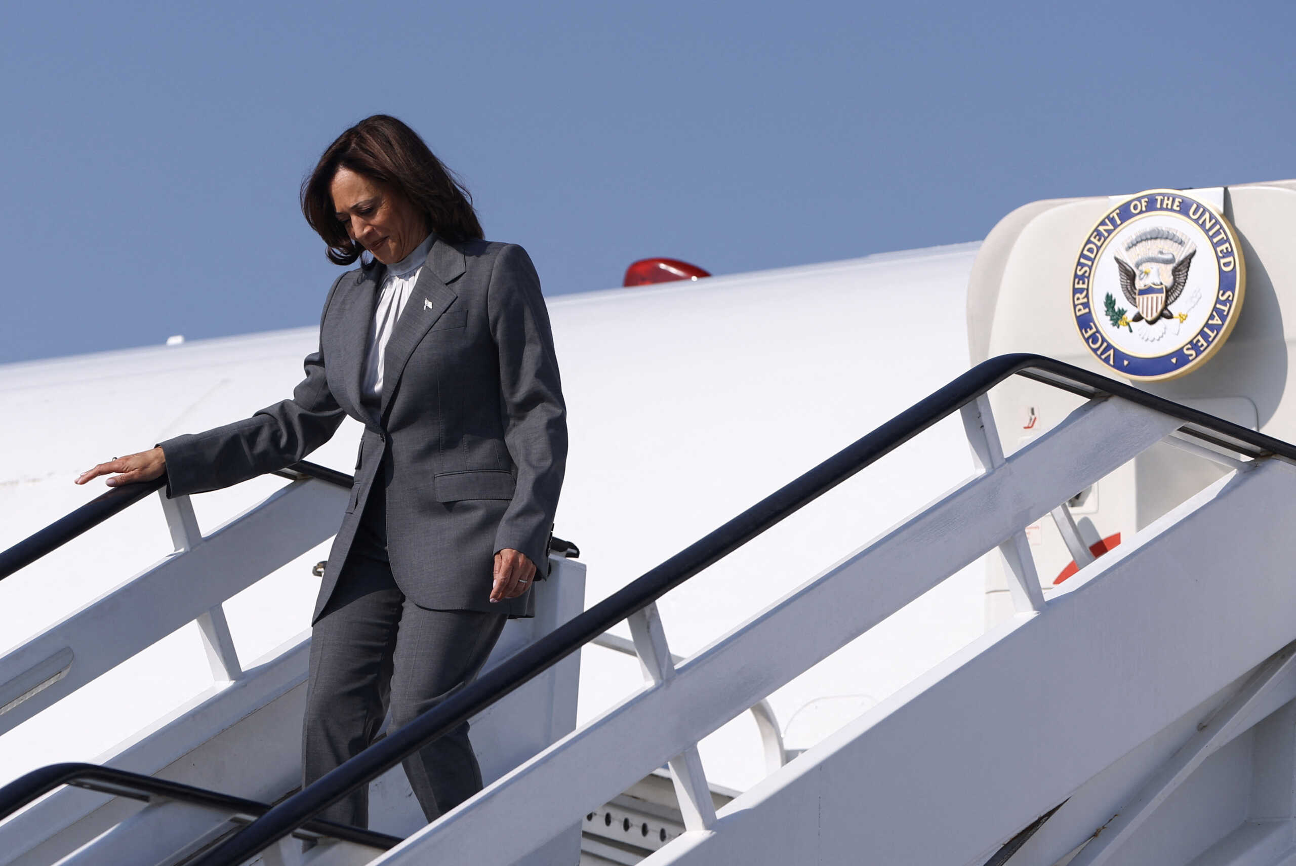 U.S. Vice President Kamala Harris disembarks an aircraft as she arrives to attend the United Nations Climate Change Conference (COP28) in Dubai, United Arab Emirates, December 2, 2023. REUTERS
