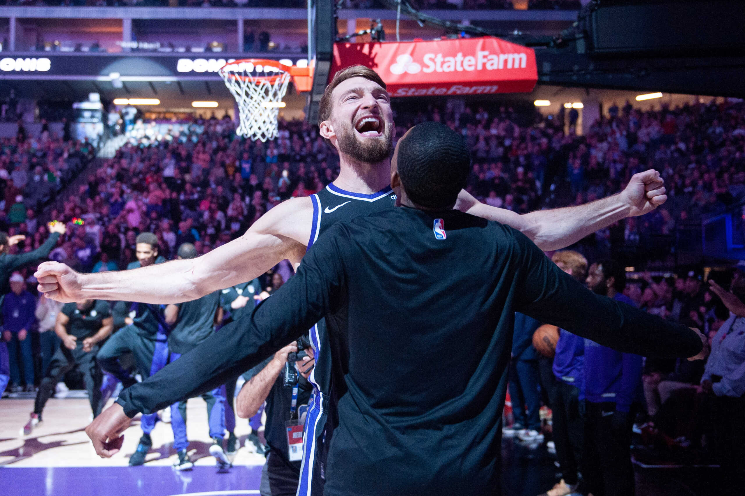 Dec 20, 2023; Sacramento, California, USA; Sacramento Kings forward Domantas Sabonis (10) celebrates with guard De'Aaron Fox (5) during pregame introductions at Golden 1 Center. Mandatory Credit: Ed Szczepanski-USA TODAY Sports