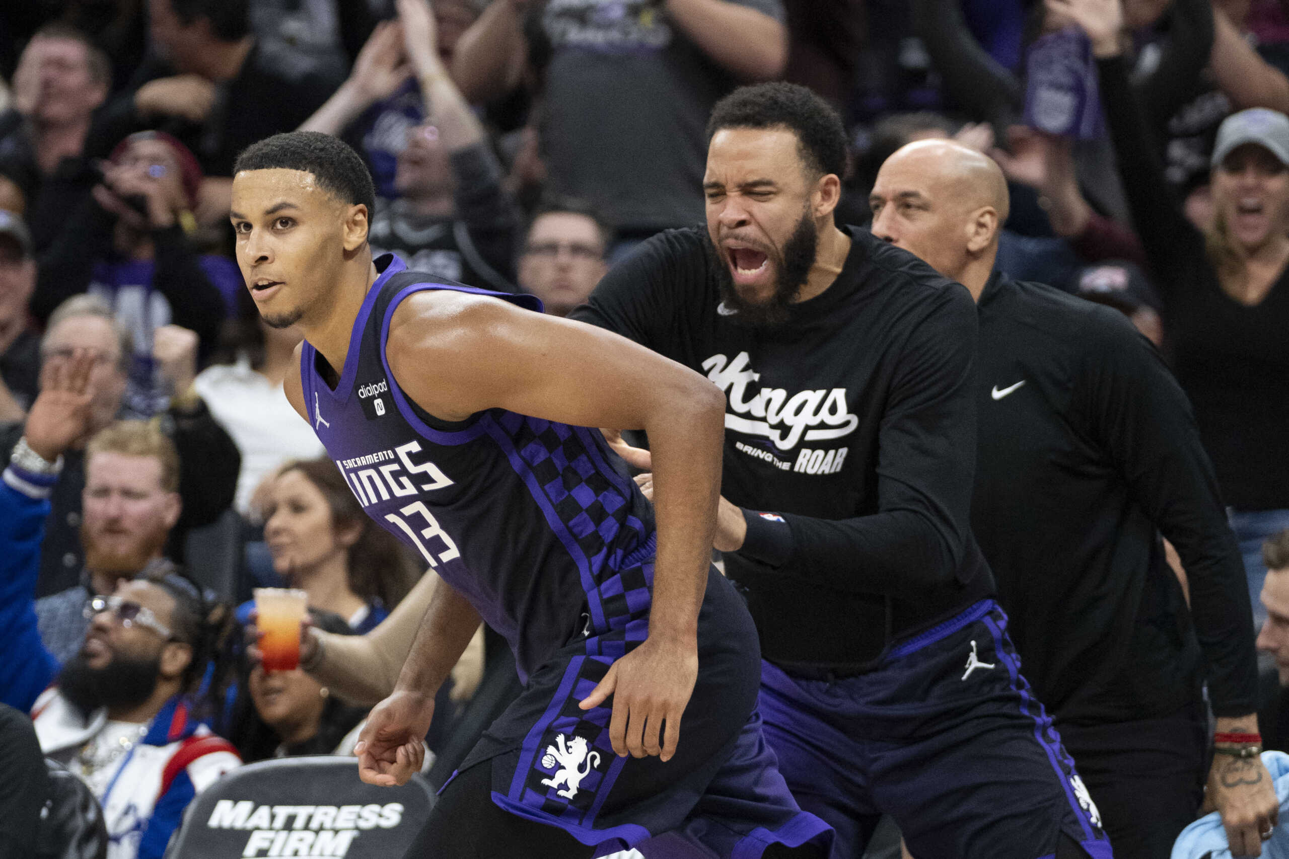 December 16, 2023; Sacramento, California, USA; Sacramento Kings forward Keegan Murray (13) is congratulated by center JaVale McGee (00) after making a three-point shot during the third quarter against the Utah Jazz at Golden 1 Center. Mandatory Credit: Kyle Terada-USA TODAY Sports