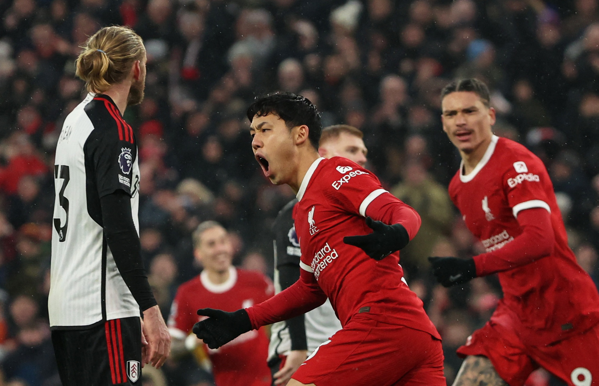 Soccer Football - Premier League - Liverpool v Fulham - Anfield, Liverpool, Britain - December 3, 2023 Liverpool's Wataru Endo celebrates scoring their third goal REUTERS