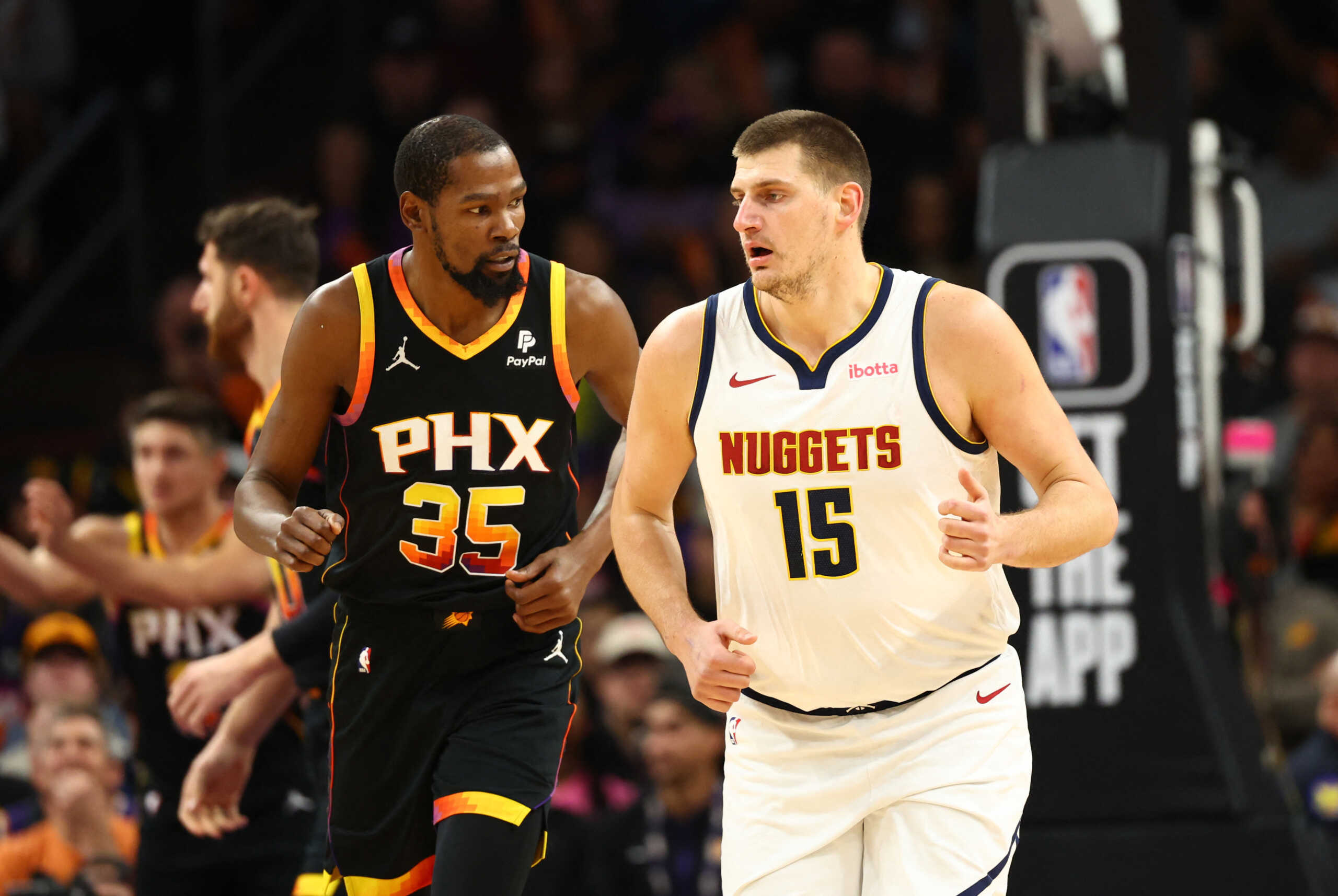 Dec 1, 2023; Phoenix, Arizona, USA; Phoenix Suns forward Kevin Durant (35) against Denver Nuggets center Nikola Jokic (15) in the first half at Footprint Center. Mandatory Credit: Mark J. Rebilas-USA TODAY Sports