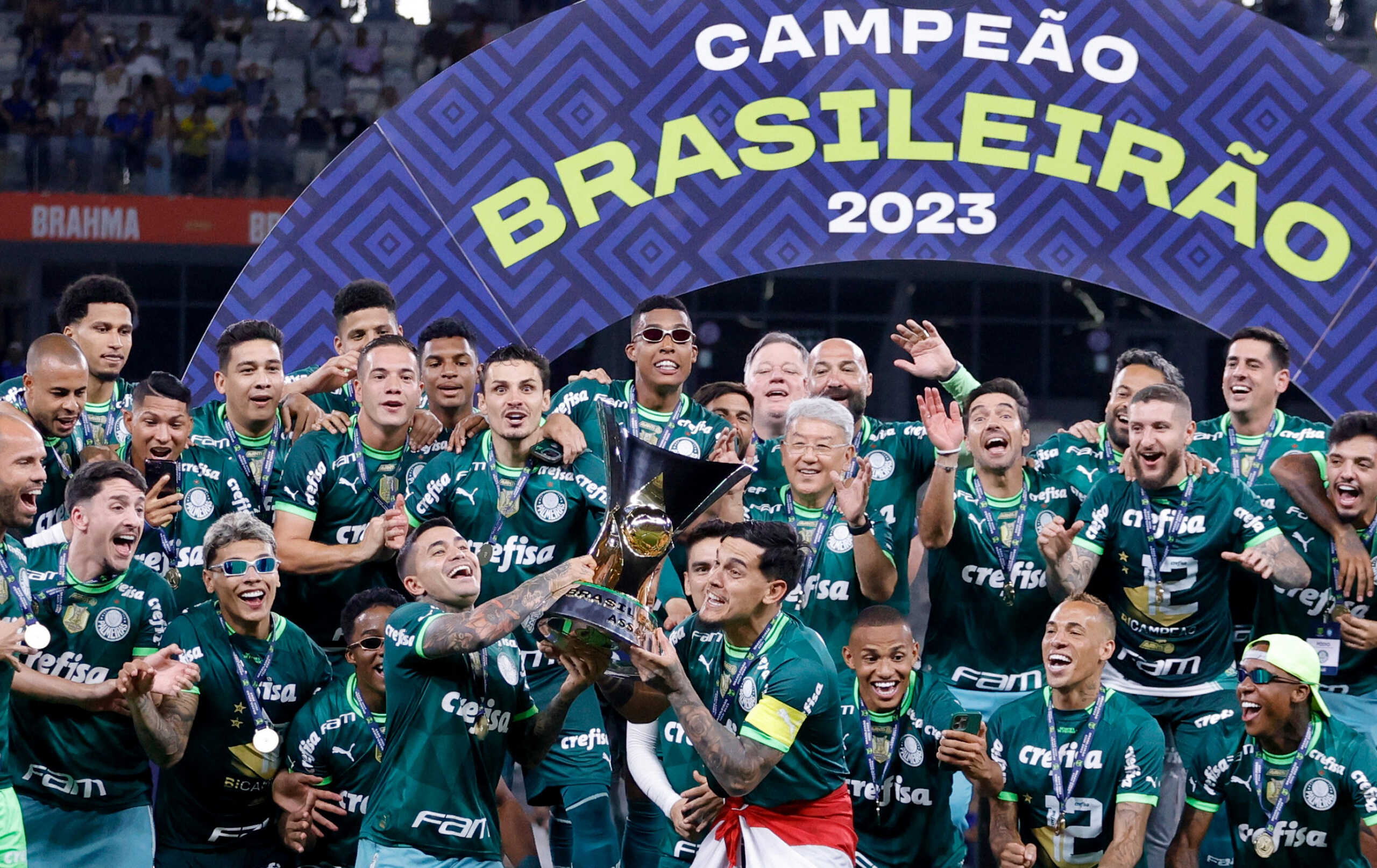 Soccer Football -  Brasileiro Championship - Cruzeiro v Palmeiras - Estadio Mineirao, Belo Horizonte, Brazil - December 6, 2023 Palmeiras' Gustavo Gomez and teammates celebrate winning the Brasileiro Championship with the trophy REUTERS