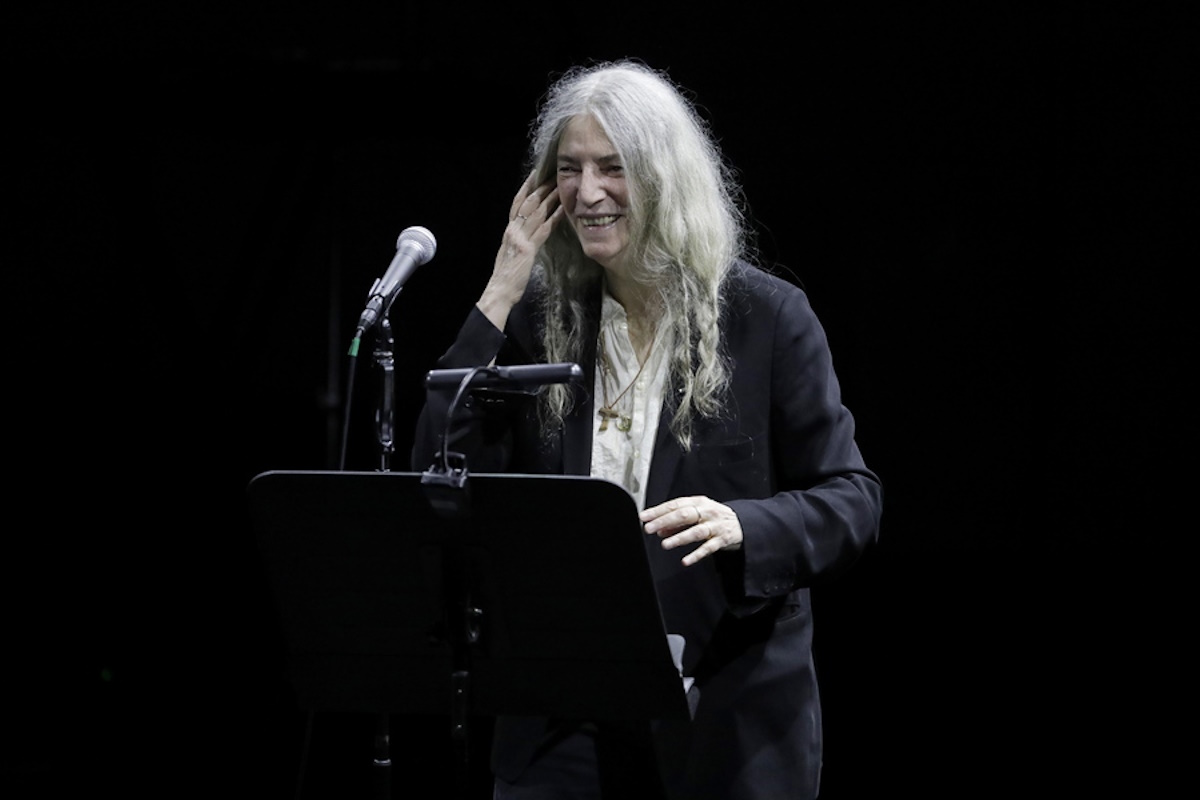 epa10768690 US artist Patti Smith performs in concert along with Soundwalk Collective, at the Teatro Colon in Bogota, Colombia, 25 July 2023.  EPA