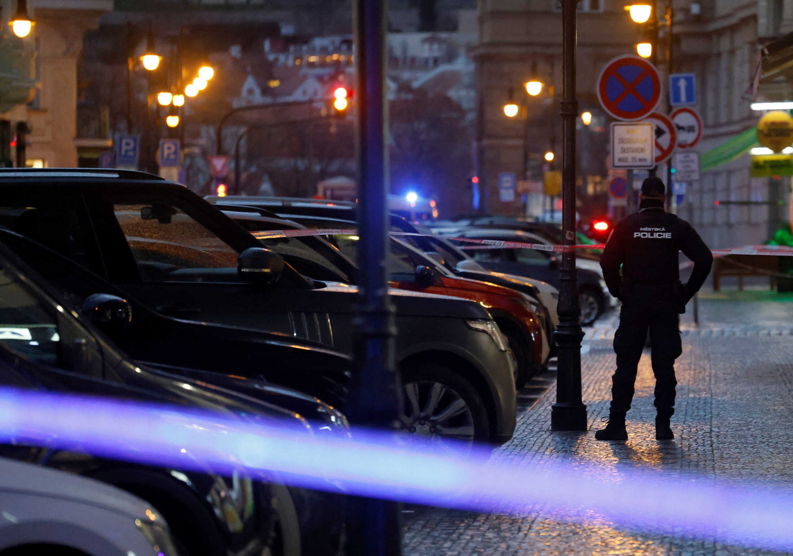 A police officer secures the area following the shooting at one of the buildings of Charles University in Prague, Czech Republic, December 21, 2023. REUTERS