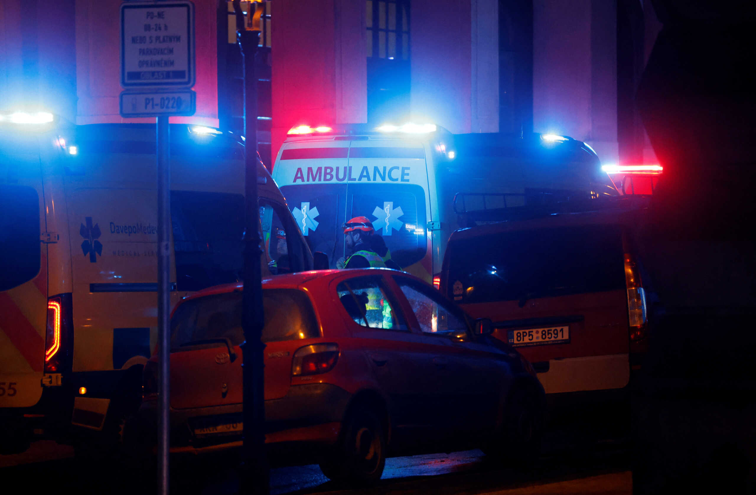 Medics stand next to ambulances parked near the area of the shooting at one of the buildings of Charles University in Prague, Czech Republic, December 21, 2023. REUTERS
