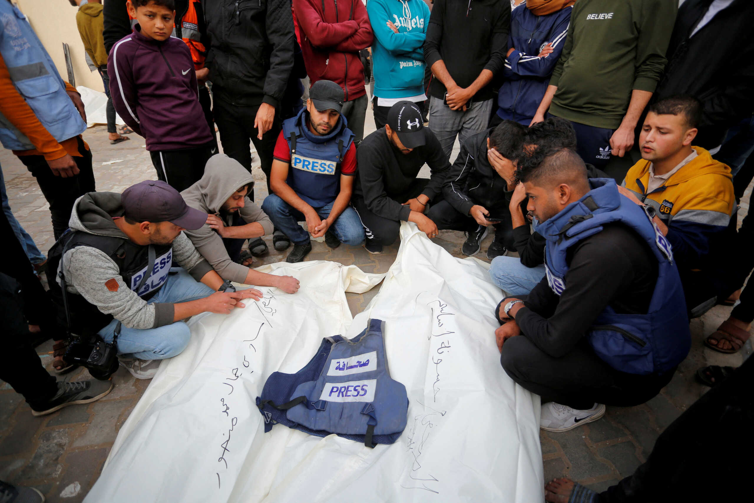 Palestinians mourn local journalists Hassouna Sleem and Sary Mansour, who were killed in an Israeli strike on a house, at a hospital in the central Gaza Strip November 19, 2023. REUTERS