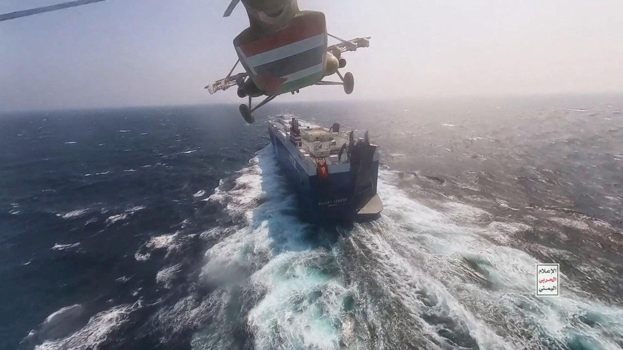 FILE PHOTO: Houthi military helicopter flies over the Galaxy Leader cargo ship in the Red Sea in this photo released November 20, 2023. Houthi Military Media