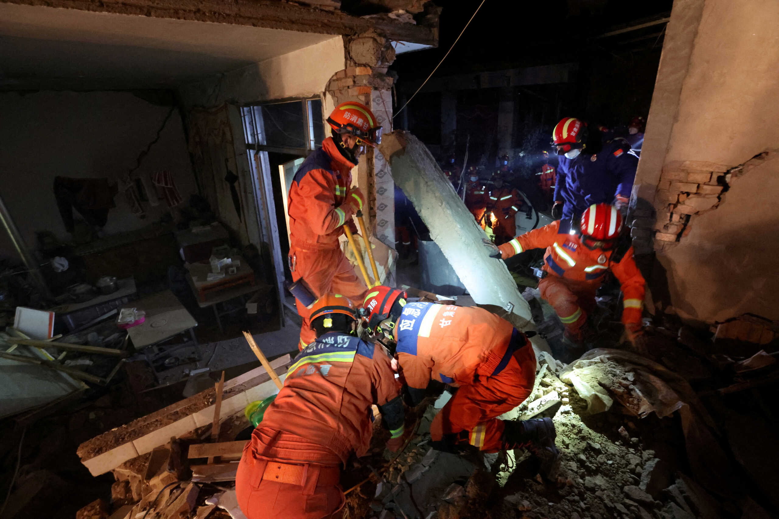 Rescue workers conduct search and rescue operations at Kangdiao village following the earthquake in Jishishan county, Gansu province, China December 19, 2023. China Daily via REUTERS ATTENTION EDITORS - THIS PICTURE WAS PROVIDED BY A THIRD PARTY. CHINA OUT. NO COMMERCIAL OR EDITORIAL SALES IN CHINA.