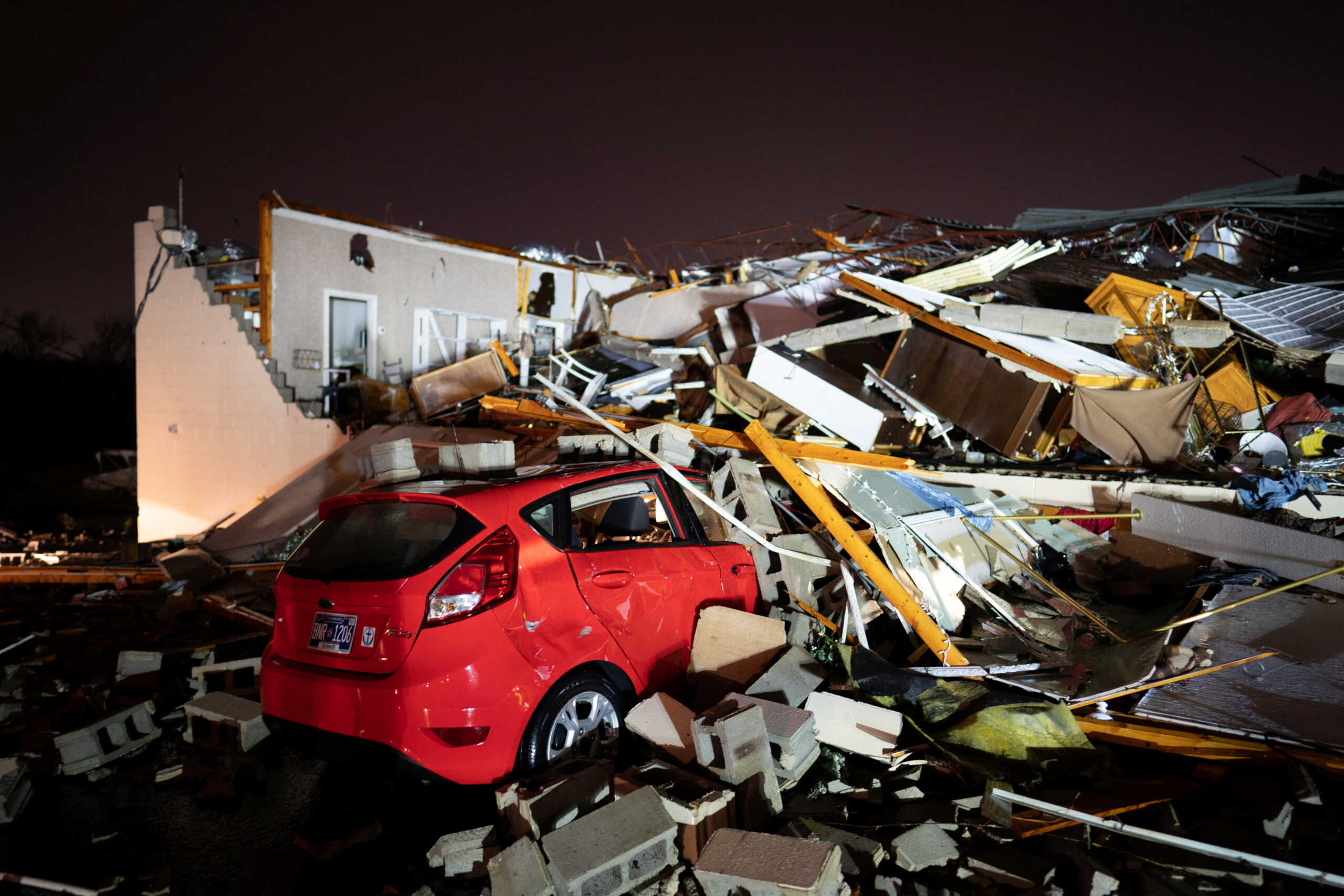 A car is buried under rubble on Main Street after a tornado hit Hendersonville, Tennessee, U.S. December 9, 2023.  Andrew Nelles