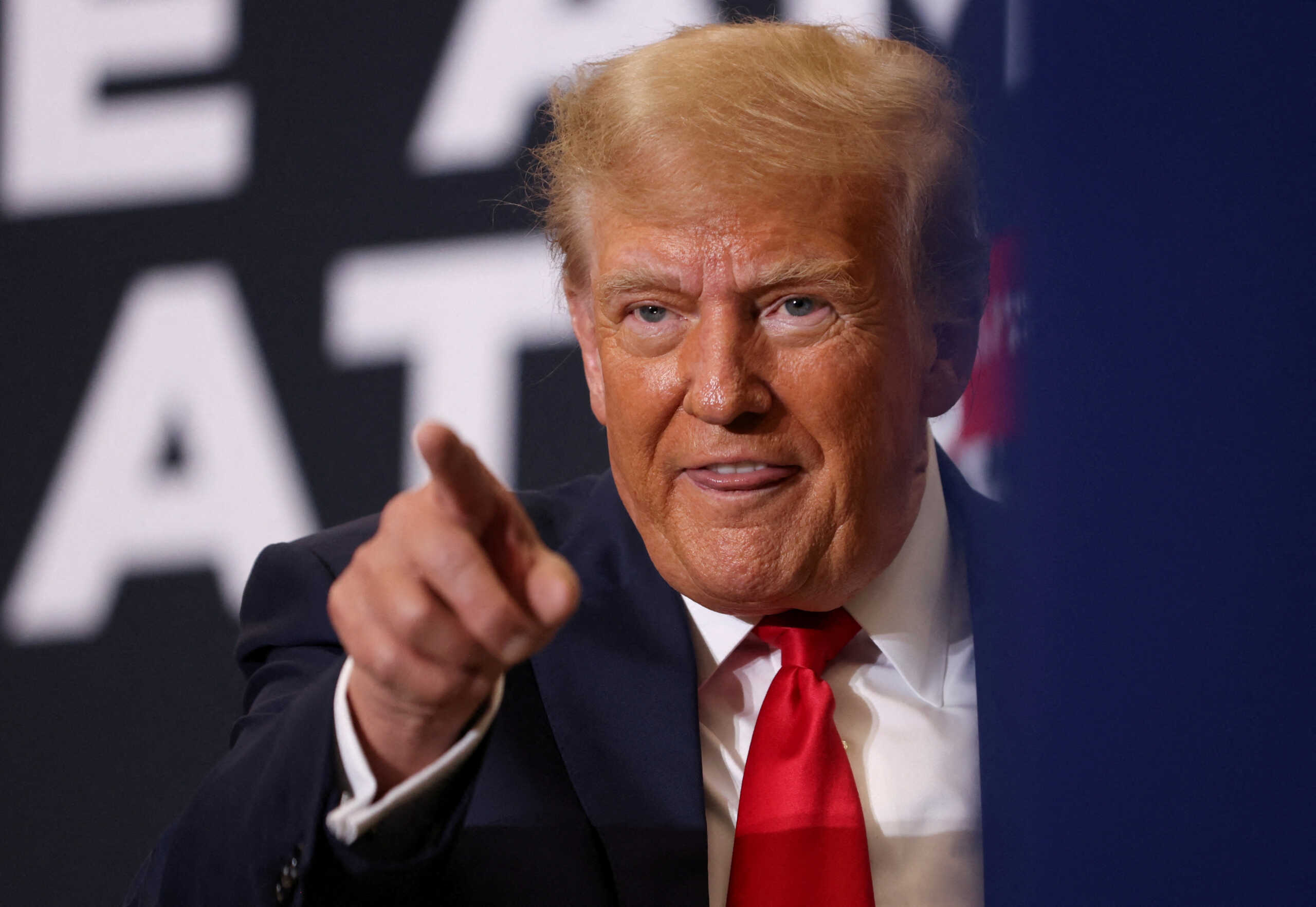 FILE PHOTO: Republican presidential candidate and former U.S. President Donald Trump attends a campaign event in Waterloo, Iowa, U.S. December 19, 2023. REUTERS