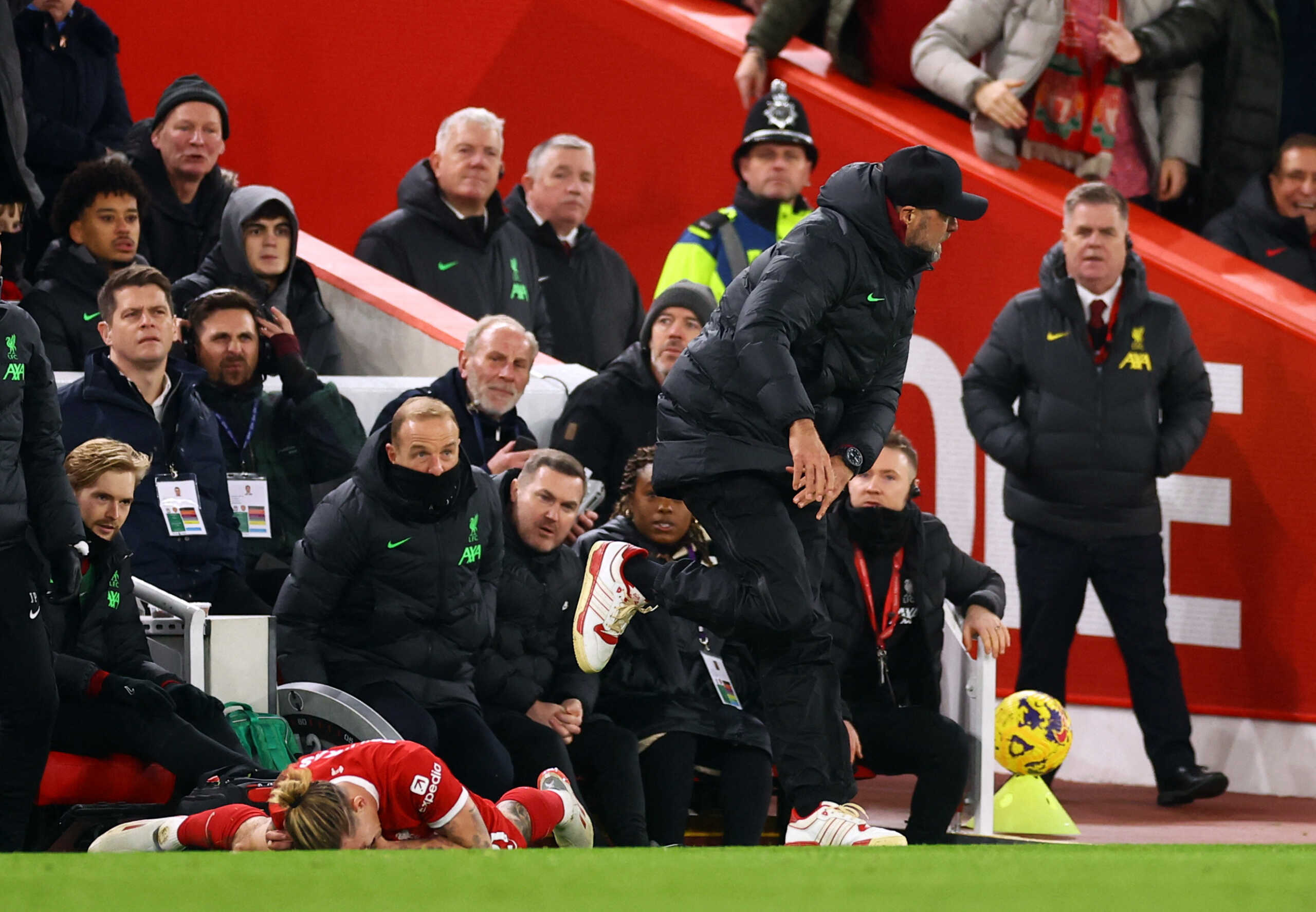 Soccer Football - Premier League - Liverpool v Arsenal - Anfield, Liverpool, Britain - December 23, 2023  Liverpool's Kostas Tsimikas after sustaining an injury as Liverpool manager Juergen Klopp reacts REUTERS