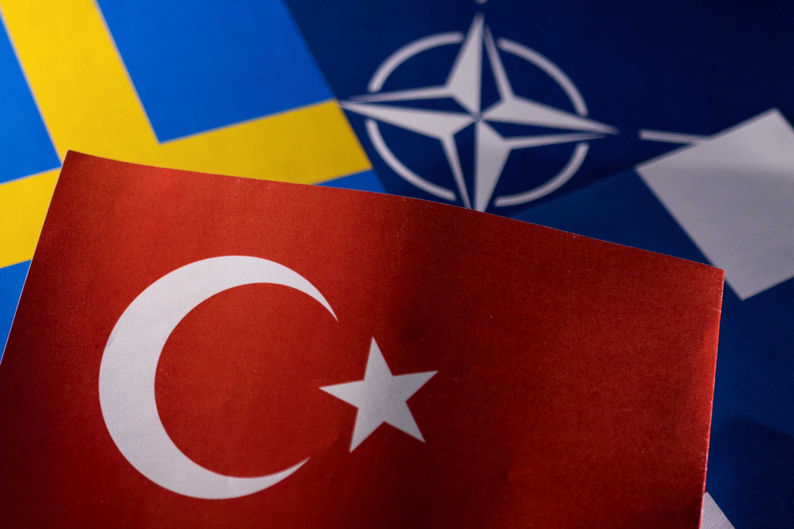 FILE PHOTO: NATO, Turkish, Swedish and Finnish flags are seen in this illustration taken May 18, 2022. REUTERS