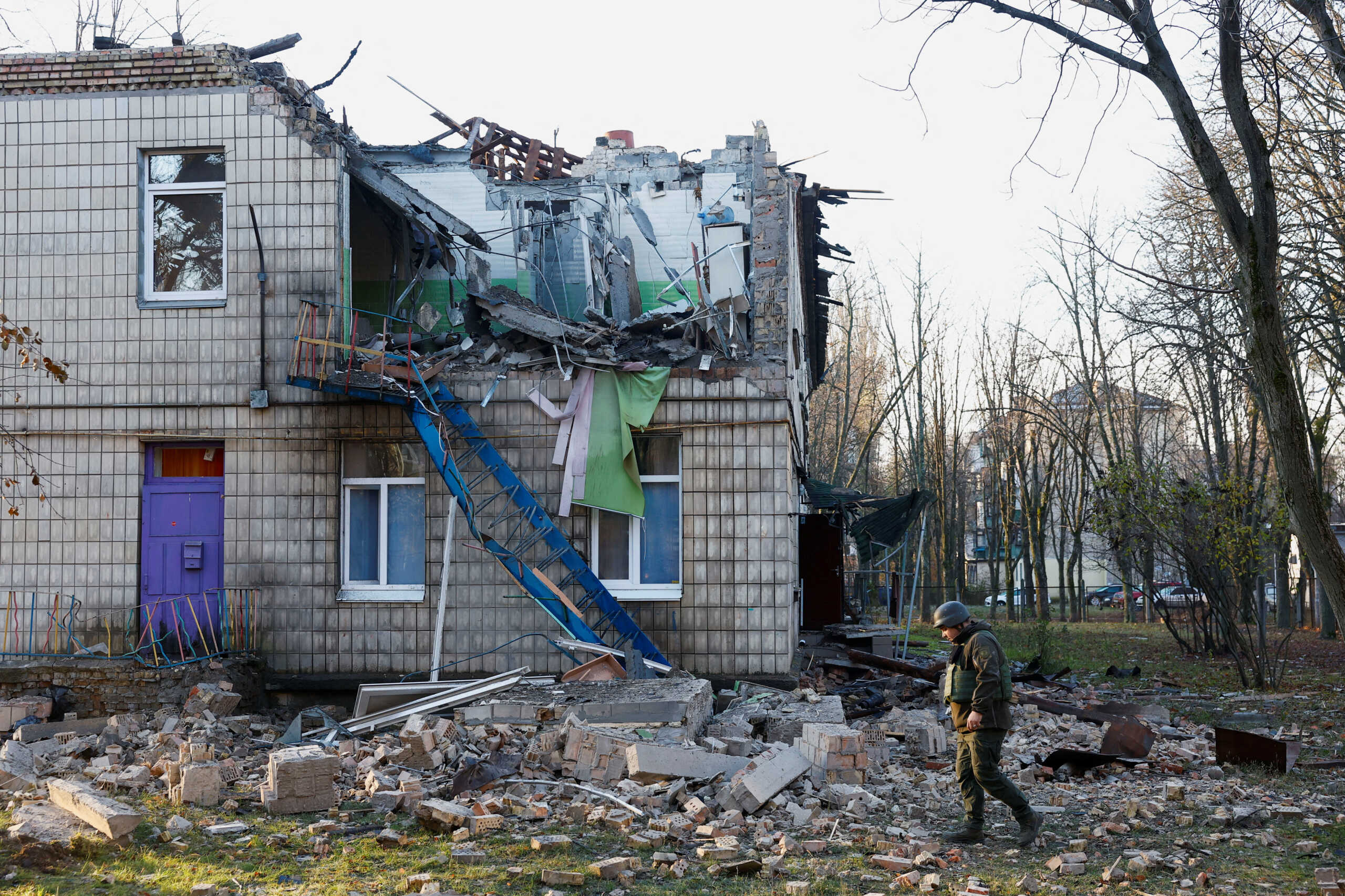 Police officers inspect the compound of a kindergarten damaged during Russian drone strikes, amid Russia’s attack on Ukraine, in Kyiv, Ukraine November 25, 2023. REUTERS