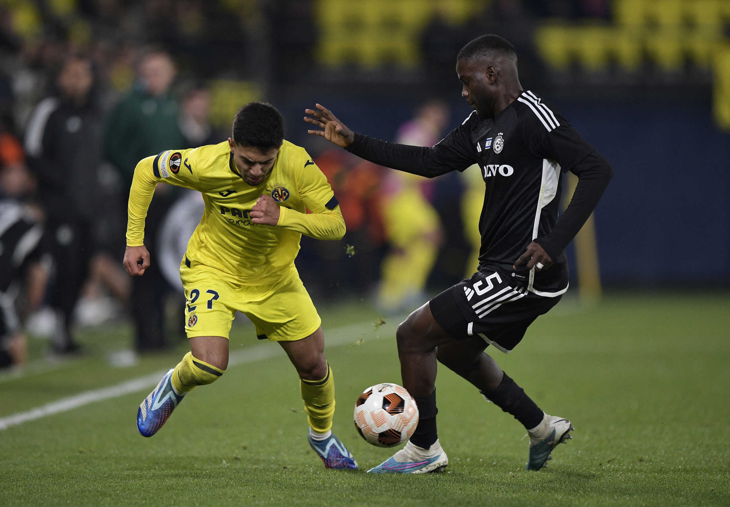 Soccer Football - Europa League - Group F - Villarreal v Maccabi Haifa - Estadio de la Ceramica, Villarreal, Spain - December 6, 2023 Villarreal's Ilias Akhomach in action with Maccabi Haifa's Show REUTERS