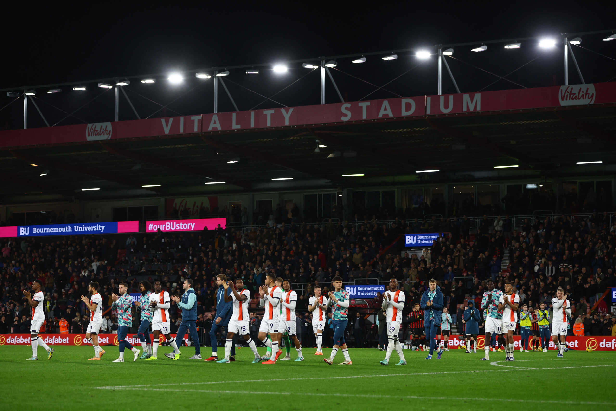 Soccer Football - Premier League - AFC Bournemouth v Luton Town - Vitality Stadium, Bournemouth, Britain - December 16, 2023  Luton Town players applaud fans after the match is suspended Action Images via Reuters