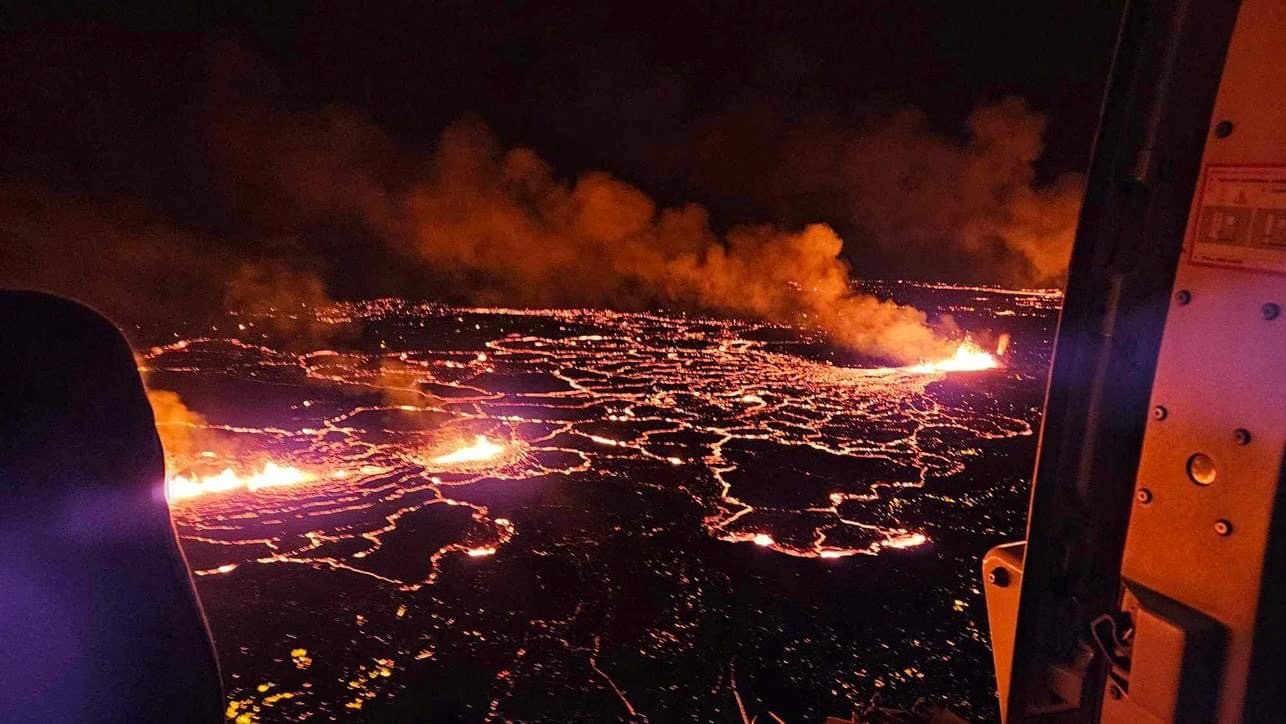 A volcano spews lava and smoke as it erupts near Grindavik, Iceland, December 19, 2023. Civil Protection of Iceland