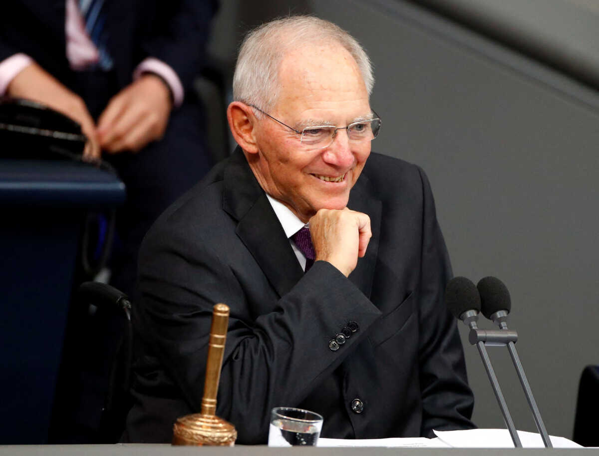FILE PHOTO: Newly elected Bundestagsraesident Wolfgang Schaeuble, smiles as he conducts the first plenary session at the German lower house of Parliament, Bundestag, after a general election in Berlin, Germany, October 24, 2017. REUTERS