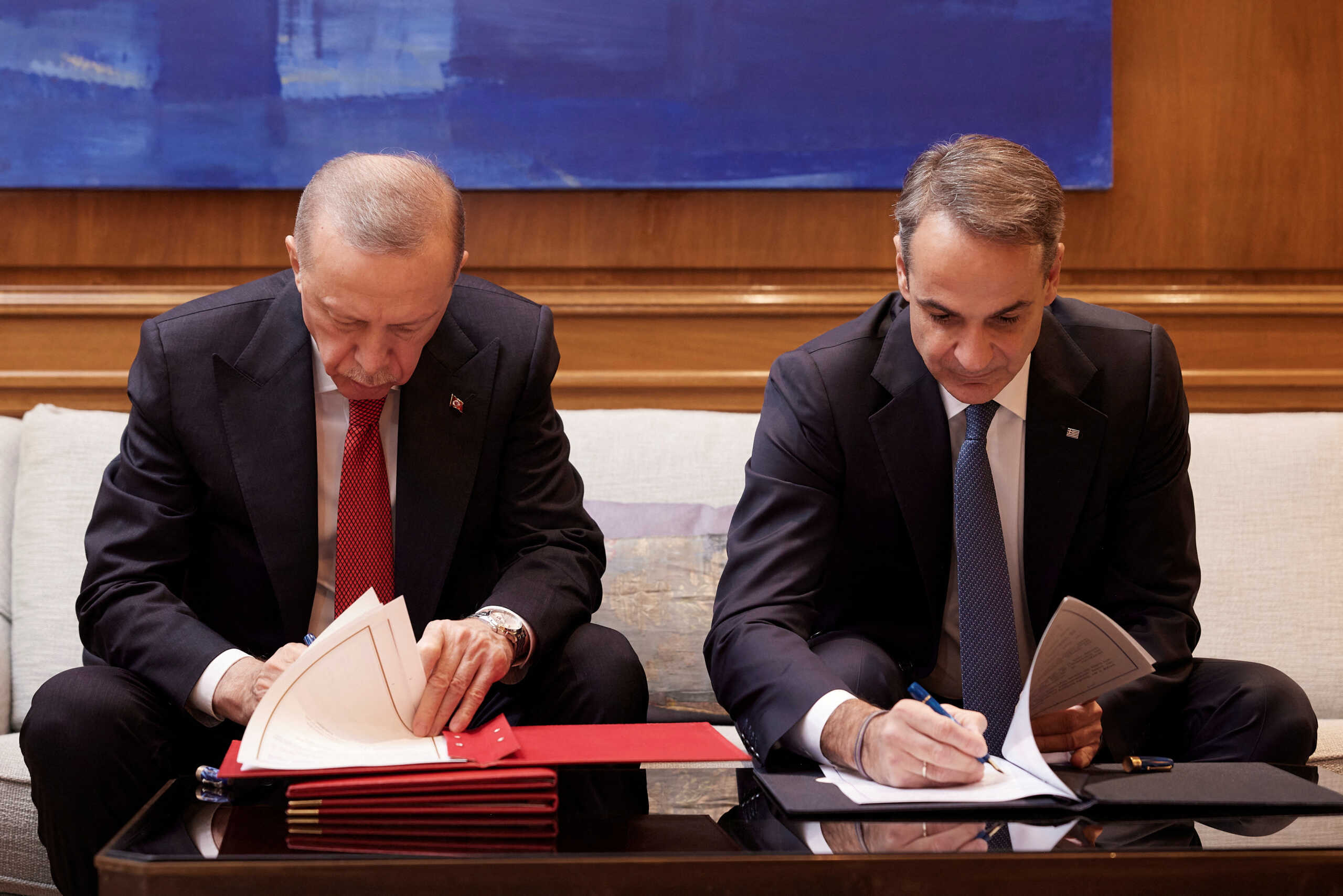 Greek Prime Minister Kyriakos Mitsotakis and Turkish President Tayyip Erdogan sign a joint declaration to pursue good neighbourly relations at the Maximos Mansion in Athens, Greece, December 7, 2023.Dimitris Papamitsos