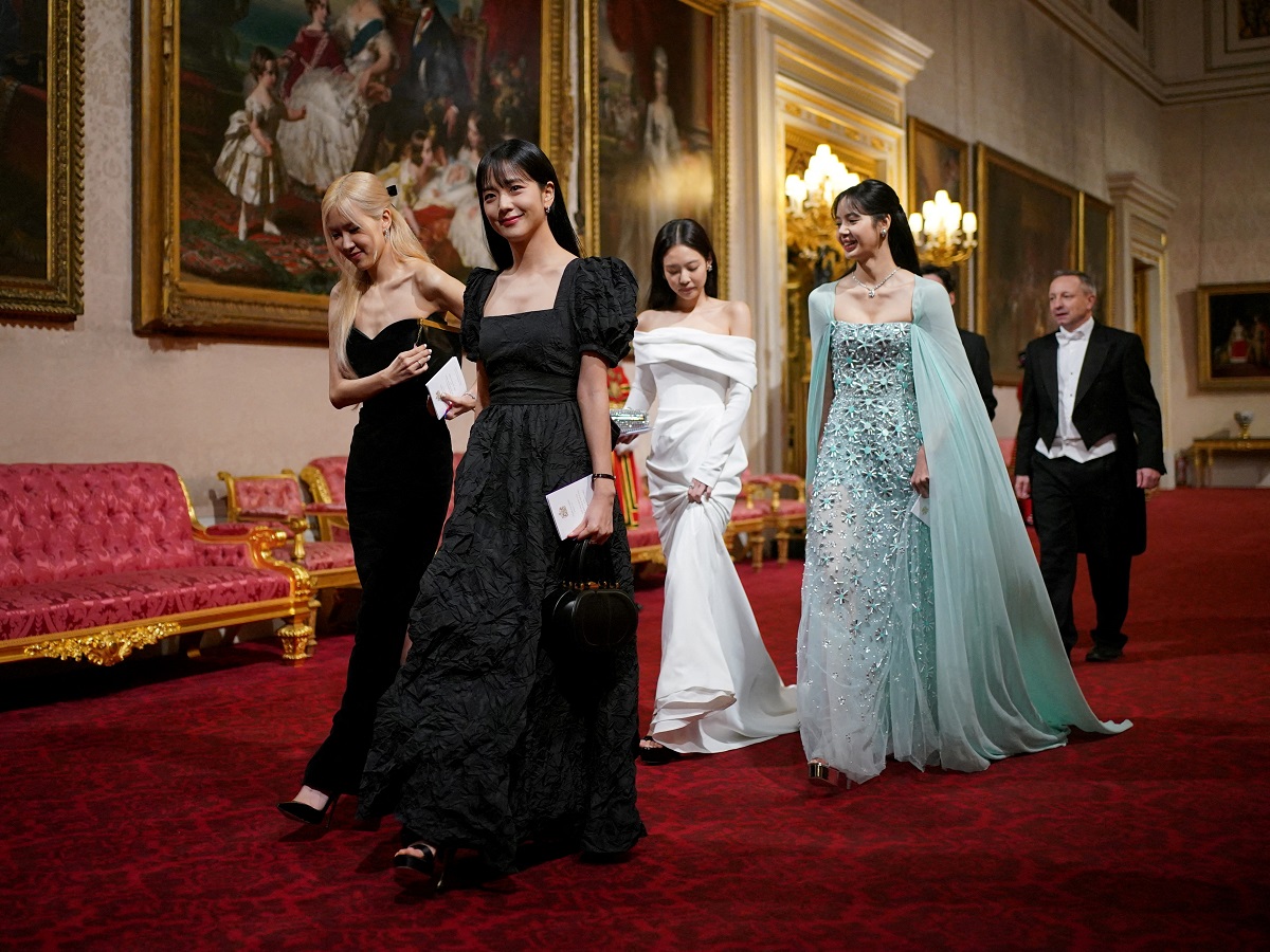 FILE PHOTO: Members of South Korean girl band Blackpink attend the State Banquet during the South Korean President state visit, at Buckingham Palace in London, Britain November 21, 2023. Yui Mok