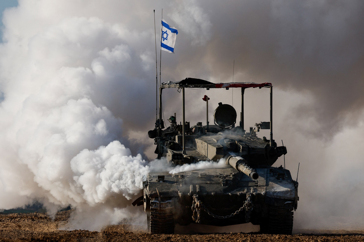 An Israeli tank manoeuvres near the Israel-Gaza border, amid the ongoing conflict between Israel and the Palestinian Islamist group Hamas, in Israel, January 24, 2024. REUTERS