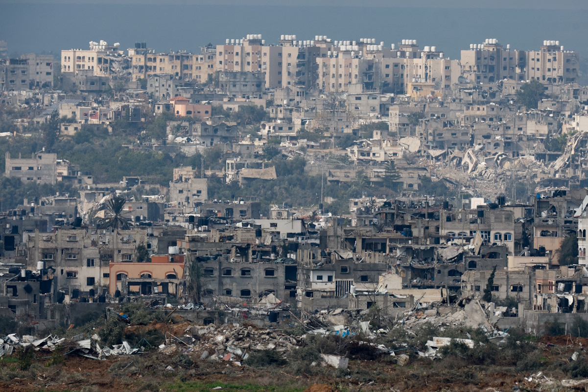 Damaged houses lie in ruin in Gaza, amid the ongoing conflict between Israel and the Palestinian Islamist group Hamas, as seen from Israel, January 24, 2024. REUTERS