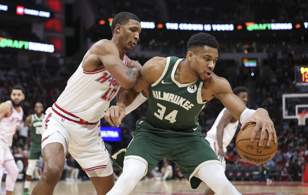 Jan 6, 2024; Houston, Texas, USA; Milwaukee Bucks forward Giannis Antetokounmpo (34) attempts to control the ball as Houston Rockets forward Jabari Smith Jr. (10) defends during the first quarter at Toyota Center. Mandatory Credit: Troy Taormina-USA TODAY Sports