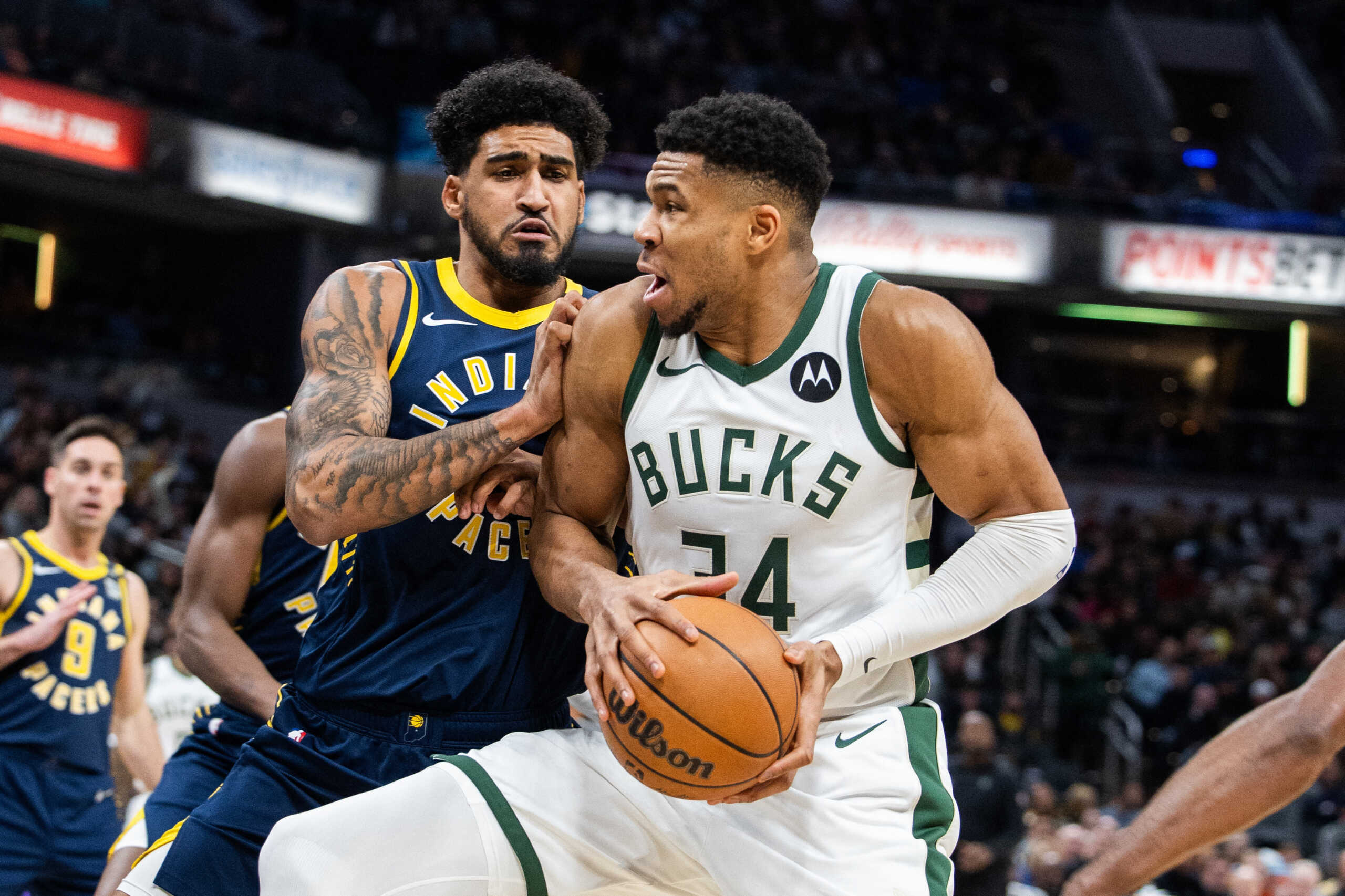 Jan 3, 2024; Indianapolis, Indiana, USA; Milwaukee Bucks forward Giannis Antetokounmpo (34) shoots the ball while Indiana Pacers forward Obi Toppin (1) defends in the first quarter at Gainbridge Fieldhouse. Mandatory Credit: Trevor Ruszkowski-USA TODAY Sports